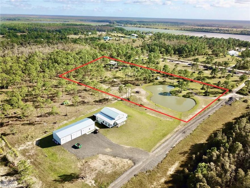 Rarely available in Estero, almost 5 Acres ready to build your dream home, farm or business! 100% UPLANDS, beautiful large pond stocked with fish, gorgeous pine trees, 44x41 barn/garage tall enough for RV with RV hookup in place, electric and well already in place. No land clearing needed, its ready to go! Tucked away just off of Corkscrew Road this is a rare opportunity to own almost 5 acres amid Estero's fastest growing area while still maintaining peace and quiet! Minutes away from the Verdana Village Publix plaza that includes a fine dining restaurant, nail Salon and Dunkin Donuts. Minutes from RAD Corkscrew Winery and Corkscrew Weddings and Windery! Kingston Development in progress just a few miles down Corkscrew Road. More growth and value to come, you dont want to miss this opportunity! Cows currently on property. 20 minutes to RSW Airport. Please do not access gate without prior permission.