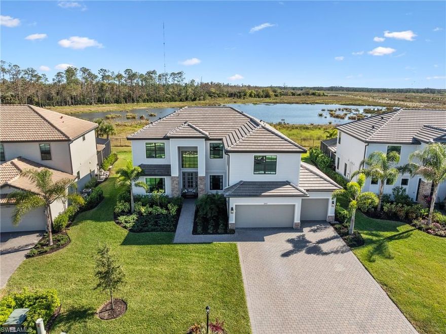 Welcome to a truly one-of-a-kind estate home in Verdana Village, where timeless craftsmanship, modern luxury, and an irreplaceable setting come together in perfect harmony. This expansive 6-bedroom + loft, 3 full-bath residence with 3 car garage is set on premium oversized homesite offering serene lake and preserve views, delivering a level of privacy and natural beauty that is becoming nearly impossible to find.     
                                                                                                                                                                                                                 
Inside, the home is richly appointed with crown molding, designer lighting, and custom woodwork, with quality craftsmanship rarely seen by today’s standards. A beautiful custom built fireplace that anchors the main living area. The chef’s kitchen is equipped with a built-in wall oven, Natural gas cooktop, pot and pan drawers, and stylish designer finishes—ideal for both everyday living and entertaining. Tasteful décor throughout, complimented by soaring 9.5 ft ceilings and 8-foot doors on both levels, enhances the home’s warm yet refined atmosphere.       
                                                                                                                                                                       
The true showstopper lies outdoors. Step onto your massive 50-ft covered patio and take in the sights and sounds of nature—morning coffee while watching flocks of bird’s glide over the pond and deer grazing in the preserve, then unwind in the evenings with jaw-dropping sunset views by your custom-built pool and spa.  It’s a sanctuary, designed for entertaining, making memories, and everyday enjoyment. The outdoor space features a custom (never been used) full outdoor kitchen positioned opposite a stunning entertainment wall with an electric fireplace, creating a resort-style experience right at home.      

All hurricane impact windows and doors, Flood Zone-X (no flood insurance required) 40-ft paver driveway, 70x150 ft deep OVERSIZED pie shaped lot that opens to 88-ft in the back.  Giving you plenty of privacy and gorgeous unobstructed views from every window of the home.     
                                                                                                                                                                       
This model is no longer offered by the builder, and homesites of this size are becoming increasingly rare as lots get smaller and homes get narrower.  Simply put, this is a home that cannot be built again. This is more than just a home; this is a lifestyle upgrade.  A property like this doesn’t just offer space and upgrades—it’s a statement of perspective, exclusivity, and permanence. Opportunities like this rarely present themselves twice.  This is your chance—schedule your showing today!