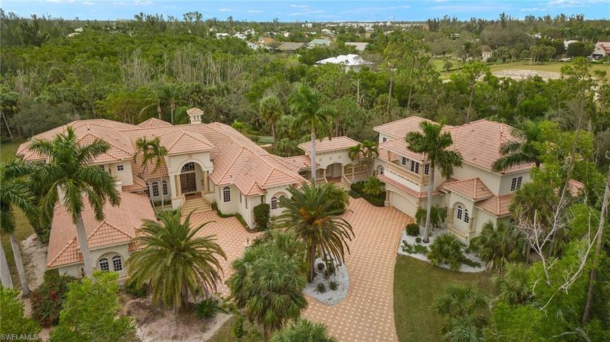 Coveted privacy and unparalleled enjoyment perfectly merge in this stunning estate. When World Series-winning Boston Red Sox pitcher Derek Lowe moved his family to Southwest Florida, they designed the perfect family compound conceived with the concept that life is short, so enjoy every minute. What resulted was this amazing 11,000-square-foot estate with everything one could imagine. From the huge in-home theater with leather stadium-style seating to the billiard room connected with a sports-watching lounge. The home blends indoor and outdoor living wrapped around an elevated pool with a fountain and waterfall and an outdoor kitchen nestled under a beautiful covered cabana. Beyond the pool is a private basketball court, a pickleball court, and a four-hole putting green. No need for a spa visit because the huge primary bath features a soaking tub, a large shower, stunning finishes, and a massage room. Not to be overlooked the home also features a yoga/ballet studio, crafting room, and cigar room designed for a walk-in humidor. A beautiful walkway takes you to the guest house where you’ll find a full gym, sauna, and locker room. The community includes a boat storage and launch area. This home has it all!