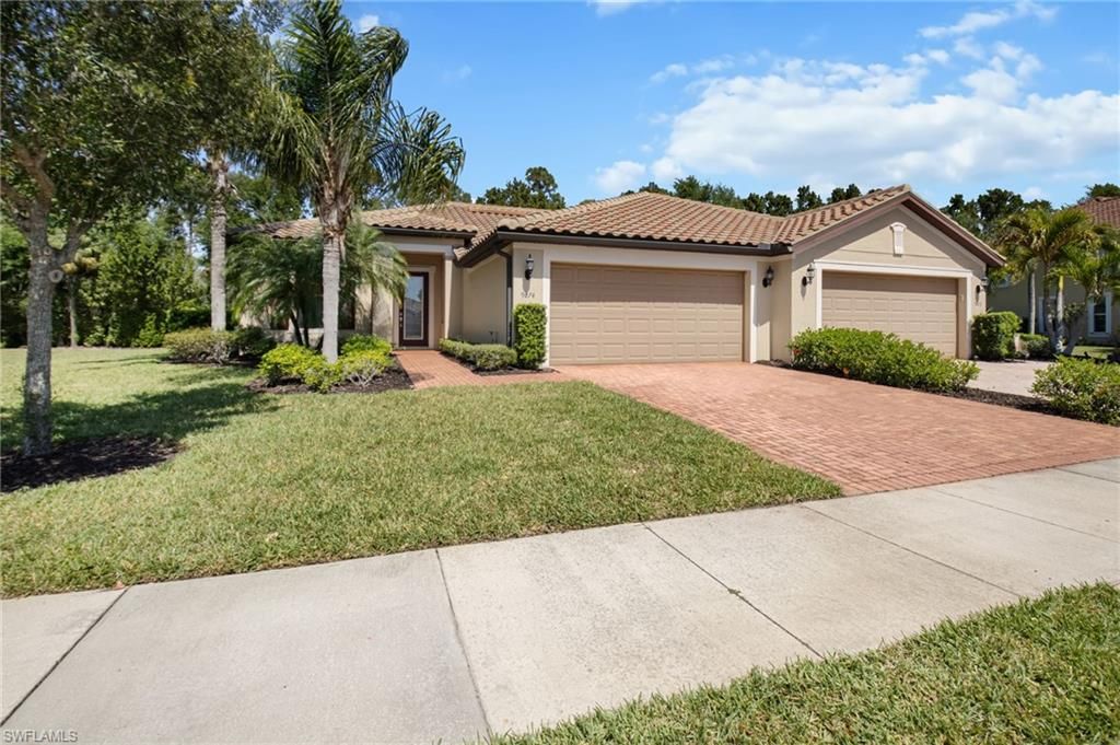 Photo of 9074 Triangle Palm LN, FORT MYERS, FL 33913 (MLS # 226015667)