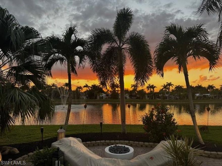 Welcome to a stunning west facing waterfront pull in lot at RiverBend Motorcoach Resort, a property that captivates you the moment you arrive. The dual fountain lake view sets a serene, picture perfect stage, while the pride of ownership is evident in every flourish of landscaping. Updated lush privacy hedging, full irrigation, and warm uplighting create an inviting ambiance day and night, and the generous green space behind the lot brings unmatched tranquility. At the heart of this property is an exceptional outdoor kitchen, a true entertainer’s dream. Granite countertops, a flat-top grill, a 24-inch refrigerator, and bar seating with built-in speakers make this the ideal spot to cook, entertain, and unwind. Afternoons drift into evenings as you gather with friends by the water, enjoy golden sunsets, and finish the night beneath a canopy of stars. The coach house is equally charming and practical. Fresh and stylish, it includes tiled floors, a kitchenette, a full bathroom with updated touches, a washer and dryer, and an on-demand water heater. The nearly new queen sleeper sofa lets the space convert easily for guests, while the wall unit keeps everything comfortable throughout the season. Beyond your own private paradise lies the full RiverBend experience. Just steps away, the Caloosahatchee River flows peacefully along the edge of the resort,  perfect for morning walks, sunset views, and watching boats drift by as you unwind. RiverBend is known for its beauty, amenities, and vibrant social life. Enjoy the expansive pool with plenty of loungers and shaded umbrellas, or unwind in the bubbling hot tubs. Explore the River Clubhouse with its bar, billiards, library, and regular entertainment like live music, trivia nights, holiday parties, and themed dinners. Stay active with Pickleball, bocce, Zumba, and a large number of clubs and activities including the Creations Guild, remote control boating on the lake and remote control race track, line dancing, and the ever popular Texas Hold Em games. Even your furry friends have their own space at the well-kept dog park. And when you’d rather take a night off from cooking, check the resort calendar,  the River Clubhouse often serves refreshments, breakfast, and dinner. This exceptional waterfront lot blends beauty, convenience, and the best of luxury Class A motorcoach RV living, the perfect place to call home within the one of a kind RiverBend lifestyle. Outdoor furniture can be negotiated, but is not included.