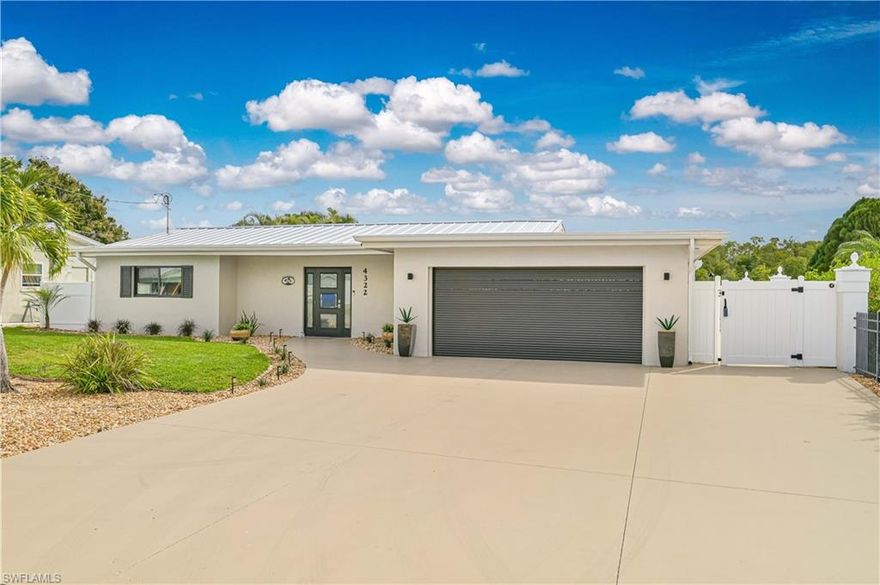 This 4-bedroom, 3-bath waterfront home is a true boater’s paradise. Located at the entrance to the Caloosahatchee River with direct Gulf access and no bridges making it perfect for sailboats and yachts. Enjoy stunning river and mangrove preserve views along with exceptional privacy in the highly desirable Waterway Estates boating community (no HOA).

Designed for entertaining and relaxed coastal living, the outdoor space is exceptional. The heated pool and sunken jacuzzi are surrounded by an extended concrete lanai featuring bar seating and a dedicated entertainment area.  Boating enthusiasts will appreciate the captain’s composite dock and 10,000-lb covered boat lift, making time on the water effortless.

Inside, this completely modern home offers approximately 1,950 square feet of open-concept living with tile flooring throughout. The stunning kitchen features gorgeous cabinetry, custom tile work, a gas stove with hood, and seamless flow into the main living and dining areas. The split floor plan includes two spacious primary suites with walk-in closets and updated custom baths.

Water and preserve views are enjoyed from nearly every room, creating a serene coastal atmosphere throughout. Recent improvements include fresh exterior paint, hurricane-impact windows and doors, a hurricane-impact garage door, tinted windows for energy efficiency, privacy shades, a new metal roof (2025), newer AC (2022), and a whole-house flood panel system. Affordable flood insurance is in place and transferable to the new owner. The property experienced no water intrusion during Hurricanes Helene or Milton.

Located on public water and sewer in one of the area’s most charming boating neighborhoods, this home offers the perfect combination of waterfront lifestyle, modern updates, and peace of mind. See feature sheet for additional upgrades and frequently asked questions.