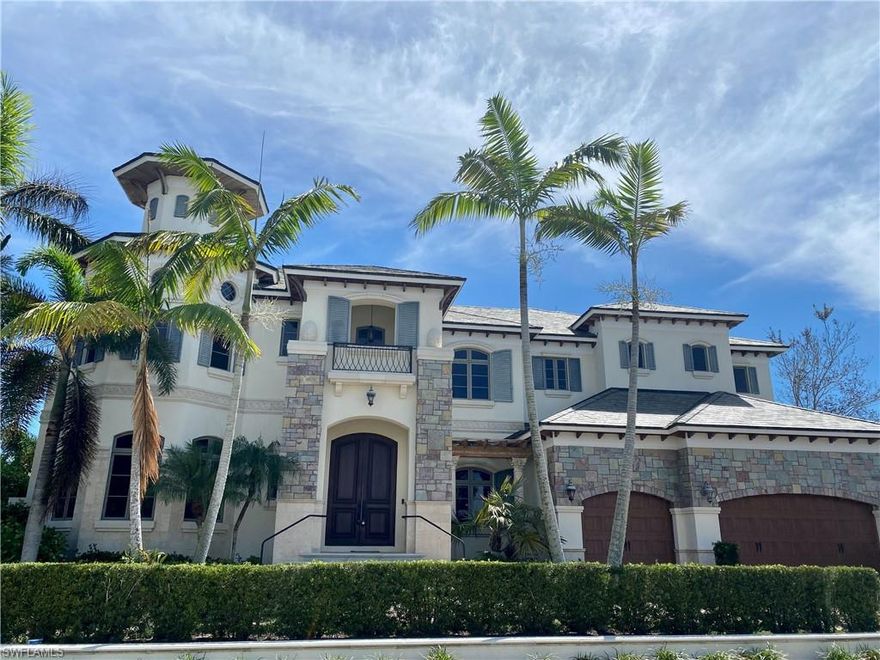 H6926 Welcome to your castle in the sun! This gorgeous direct access southern exposure, river view home features soaring 23’ ceilings, custom wood details & marble floors. Walk into the formal living area with exquisite cabinetry & fireplace to enjoy views of the  beautiful yacht club and wide water canal. The family room, open to the kitchen area features sliding glass doors across the back offering those water views and enjoys an abundance  of natural light and a full bar area for entertaining. The open kitchen with island boasts Thermador appliances, 6 burner gas stove and warming drawer, 2 drawer subzero freezer and refrigerator, Bosch dishwasher and exquisite custom cabinetry. The upstairs features the grand master suite with his and hers walk in closets, coffee/wet bar with refrigerator, walk in shower with rain shower, large jacuzzi tub and separate sitting area. Master and full guest suite have access to large upstairs lanai offering views of the Jolly Bridge and River. Complete with elevator, whole house automation, lighting, solid doors and whole house generator. An open lanai with negative edge pool, cascading waterfall spa, summer kitchen & large dock complete this extraordinary home.