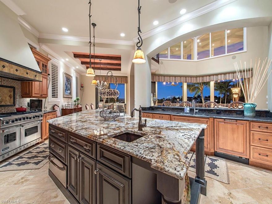 H.15620 -Stunning bay views! Outstanding Gulf access residence located on one of the preferred 3 streets off Gulf Shore Drive. Only one minute walk to the beach. The finest of craftsmanship throughout the home built by Southern Bay Homes, with amazing attention to details. Voluminous living area with luxury appointments opens up to the beauty of the outdoors via the large sliding glass doors, which create a relaxing and soothing atmosphere.  A stunning chandelier is a main focal point in the rotunda style foyer. Living area perfect for entertaining complete with fire place and dramatic wood beam ceiling treatment. Spacious kitchen equipped with a breakfast bar for 4, wine cooler, Sub-Zero and Miele appliances. Third floor includes a bonus room with expansive windows featuring beautiful views of the Gulf. For convenience there is second and third floor laundry. Oversized heated pool, outdoor kitchen, and inlaid wood ceilings. Generous sized dock and lift. Perfect combination of beach and boating!