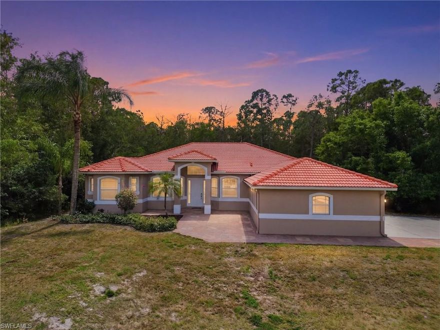 One or more photo(s) has been virtually staged, AI generated or rendered.  Welcome to 2480 52nd Ave NE in Naples—where comfort, space, and style come together in this amazing Southwest Florida pool home set on 2.73 private acres. This expansive residence offers 4 bedrooms, 3 full bathrooms, a dedicated den or office, formal dining and living rooms, a spacious family room and a cozy breakfast nook. The well-designed kitchen features stainless steel appliances, granite countertops, a center island, a walk-in pantry, and a built-in desk, making it perfect for both everyday living and entertaining. A laundry room and 3-car garage add to the home’s functional layout. Recently refreshed from top to bottom, this move-in ready home showcases a bright, modern feel with freshly painted interior and exterior, brand-new Lifeproof luxury vinyl plank flooring throughout, updated bathroom vanities, lighting, and mirrors, and beautifully refinished kitchen cabinets—just to name a few updates.  The generous primary suite offers two separate walk-in closets and a spacious en-suite bath complete with dual vanities, a soaking garden tub, and a separate shower. Step outside to enjoy your private pool and lanai, with convenient access from the family room, living room, and primary bedroom—perfect for seamless indoor-outdoor living. With abundant space for both everyday living and entertaining, this home has it all. The property also features an upgraded keystone paver driveway leading to the garage area, plus an additional parking area ideal for extra vehicles or visitors.