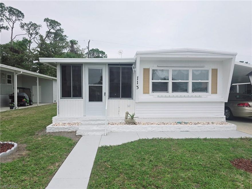 Welcome to this charming 2-bedroom, 1-bath single-wide mobile home, situated in the peaceful 55+ cooperative community of Enchanting Acres. This well-maintained home features a covered carport with space for two cars, a convenient storage shed with laundry, and a bright, inviting Florida room perfect for relaxing. The mobile has engineered tongue and groove flooring and in the Florida room you will find tile. As a resident of Enchanting Acres, you'll enjoy an active lifestyle with community amenities including a pool, shuffleboard, a clubhouse with a resident kitchen, a billiards room, and a library. Water, sewer, trash, lawn care, and the use of these amenities are included in the low monthly fees. Located in a prime spot, this home is just minutes from Sugden Park, Naples beaches, and Downtown Naples. The vibrant Bayshore Art’s District and various shopping, dining, and entertainment options—like Publix, planet fitness, restaurants —are conveniently across the street. This home is perfect for a seasonal getaway, full-time residence, or a second home. Note: Pets are not allowed, and ownership is Co-Op.