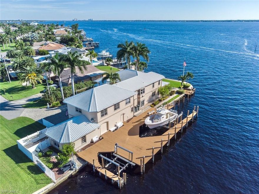 Sunrise to Sunset it’s all about the VIEW here! One of the MOST UNIQUE homes on the Caloosahatchee Intra-Coastal waterway in SW Florida w/ nearly 280’ of breathtaking unobstructed panoramic VIEWS! Incredible dock set up w/ 80k lb lift, 10k lb lift & 2 jet ski lifts. VIEWS from every room in the house. Soaring ceilings & extra lg windows make you feel like you're on a cruise ship w/ lots of natural light. Spacious Chef’s Kitchen designed for ultimate entertainment & VIEWS!  Prestigious +1,500 SqFt master suite w/ private balcony & the best VIEWS of the home: Brazilian hardwood floors, 2 offices, walk-in closet, shoe closet, fireplace, lg bath w/ jetted tub & Moen U shower along w/ morning kitchen. Toto washlet bio-bidet toilets in all suites. Master sized guest rooms w/ en-suite baths & tons of closet space. Huge game room w/ full bath & kitchen. Rm to add more bedrooms or expand over the 5 car +2,600 SqFt air conditioned garage w/ garage door to dock. Smart home w/ upgraded ethernet. Properties like this are extremely rare to market! Call for many more details!