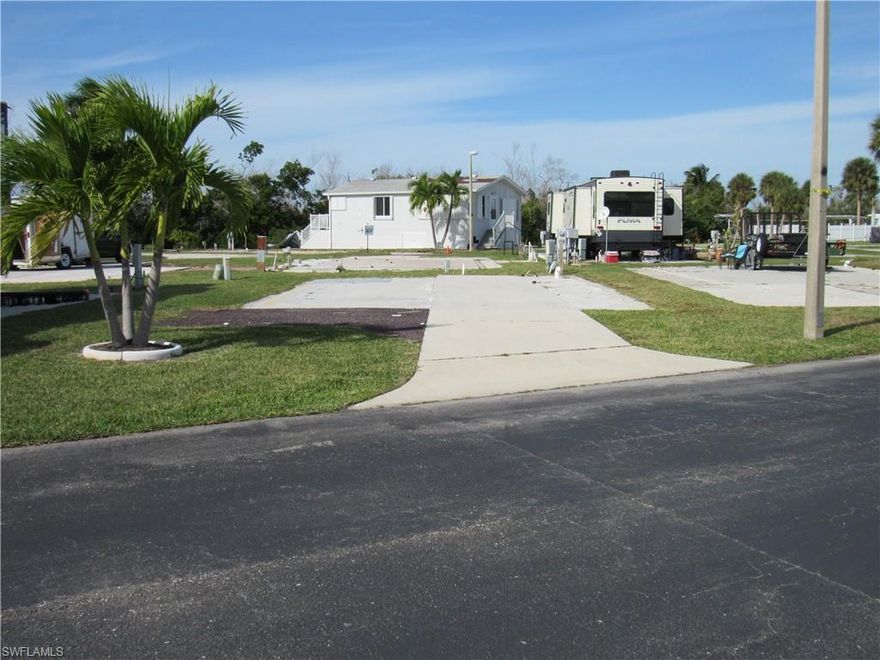 LOCATION! LOCATION! Situated on a 2-way street in Palmetto Palms!  Comes complete with your own palm tree! Explore an exceptional investment prospect nestled within a dynamic 55+ community, rising from the aftermath of Hurricane Ian's devastation. This expansive lot offers the flexibility to accommodate your travel trailer or the possibility of adding a brand-new manufactured unit, providing versatile options. With the ability to rent units for up to 7 months yearly, seize the opportunity to generate additional income. Revel in an array of amenities, including dual pools, a clubhouse, shuffleboard, pickleball, & volleyball—creating an engaging environment filled with activity and a strong sense of community. Delight in leisurely bike rides around the expansive park or enjoy the convenience of electric golf carts. Embrace the of ease access to Ft Myers Beach and Sanibel, granting you effortless entry to the famous beaches along this breathtaking coastline.  Discover an array of shopping venues & a large assortment of fabulous restaurants, elevating everyday living to a delightful experience.  Buy now & become part of the exciting revival of Ft Myers!