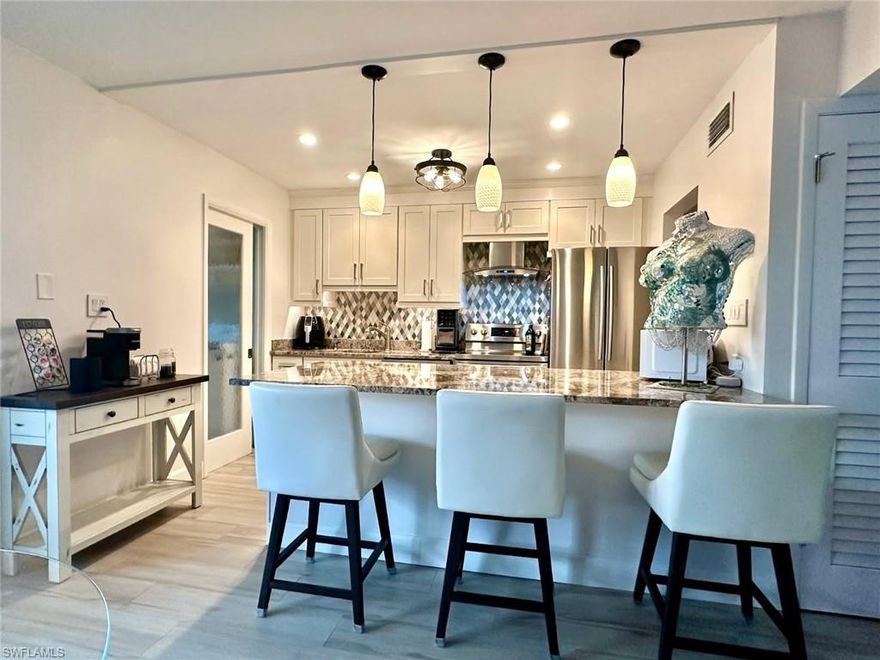 This impeccable condominium offers the best of all worlds. From the lush, green treetop views & fully remodeled interior to one of the largest & finest swimming pools in Naples. All located close to Your private Beach Club & to the summit of Naples shopping & dining at The Village Shops on Venetian Bay or 5th Ave. You’ll notice the stunning space the moment you enter this perfectly priced luxury home. From 2019-2023 the interior has been re-invented with upscale upgrades: Customized kitchen, bathrooms & Laundry room in an expanded open floor plan; Custom cabinets throughout plus a huge granite kitchen Island. Heavy duty Impact windows & sliding glass doors; Designer 8”X35” Tile flooring; All new Lighting & ceiling fans, Lutron shades, flat textured ceilings & much more in a home that welcomes your refined taste. Park Shore is as fine as any community in Southwest Florida. Stroll along the most photographed stretch in Naples, with the Gulf on one side and fabulous Bayside cantilevered Mansions on the other. All just a few minutes from Naples’ legendary 5TH Ave. The Village on Venetian Bay reflects a classic Mediterranean theme with meandering terra cotta walkways, quaint courtyards, Venetian-style facades, and a relaxed bayside ambiance. A gorgeous waterfront setting and inviting boutique style shops add to the ambience.