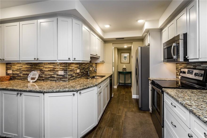 Rare 3 bedroom end unit with a beautiful view of the bay!! This is a must see, beautiful, gorgeous, alluring unit in the prestigious Park Shore area!! Just a couple minute walk to Venetian shops and restaurants which are not even one tenth of a mile away!! Also just a short walk to the Park Shore private beach! This unit has 2 AC units installed in 2016!  Ceramic tile and crown molding throughout! Dock leases with Gulf access are available for a very low fee. Common areas include indoor sitting area, chiki bar with TV, grill and pool all overlooking the bay!! It doesn't get any better than this! Move in Ready! Covered parking near the front entrance! Secure building access and storage lockers (this unit also comes with its own locked large storage room). The buildings exterior was recently refinished and a new seawall installed a few years ago!