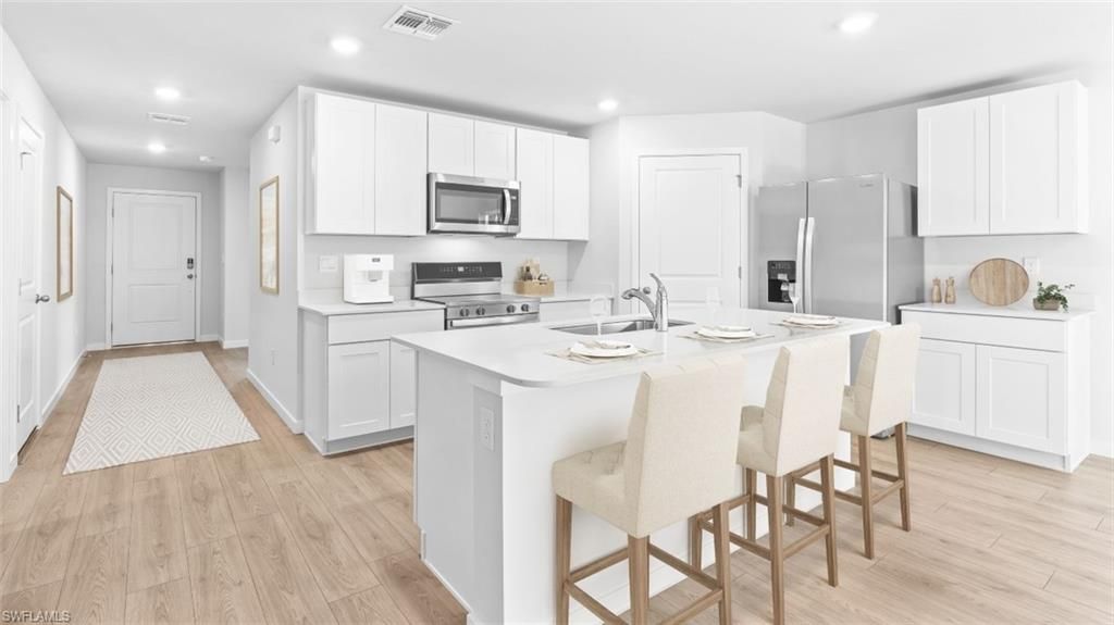 Photo of 387 RADIANT SUN LN, LEHIGH ACRES, FL 33936 (MLS # 226016857)
