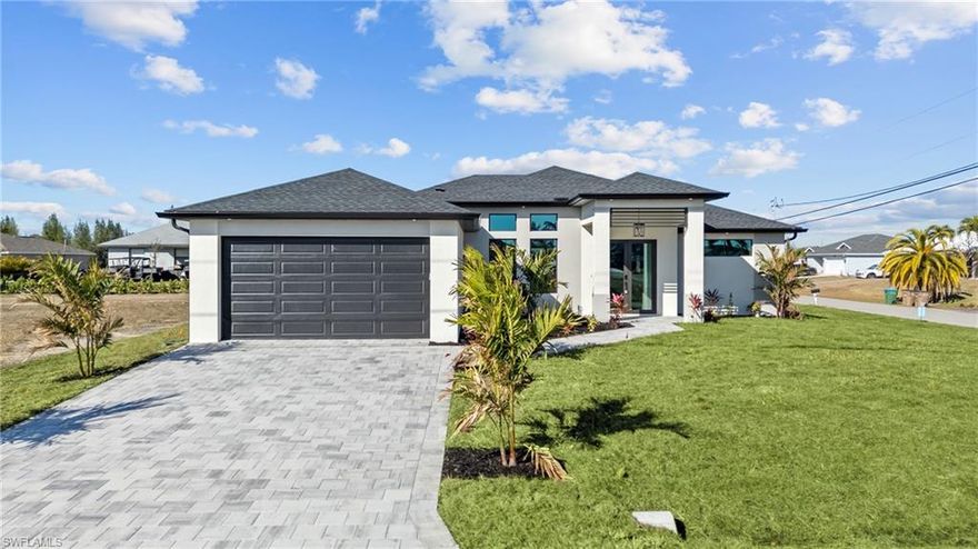 Welcome to this stunning NEW CONSTRUCTION beauty in Cape Coral, sitting on a CORNER LOT and offering over 1,700 sq. ft. of modern luxury with 3 bedrooms and 3 full bathrooms—including a highly desirable pool bath, perfect for when you add your dream pool.

From the moment you walk in, you’ll feel how meticulously this home was designed. The tall ceilings with tray LED lighting, and sleek open layout create a bright, airy feel that’s perfect for entertaining. The split floor plan gives everyone their own space and privacy—while still keeping the home open and connected.

The kitchen is a showstopper: spacious, modern, and built for real living, featuring a STYLISH BACKSPLASH, SOFT-CLOSE CABINETS, SLEEK BLACK STAINLESS STEEL APPLIANCES including built-in MICROWAVE/OVER COMBO and a HOT WATER POT FILLER/WARMER for luxurious convenience.

The best features of the home: IMPACT DOORS & WINDOWS, GUTTERS with FASCIA/SOFFIT detailing throughout, MODERN TILE throughout the entire home, Beautiful modern LED LIGHTING details, CONTEMPORARY CHANDELIERS and PRE-WIRED MEDIA WALL, HIS & HERS CLOSETS in the Owner's Suite including FLOOR-TO-CEILING TILE and GLASS ENCLOSURES for a true spa-like feel, Finished landscaping for curb appeal from day one, EPOXY FLOORING in the garage for that clean, finished look. Plus, there’s already a CONNECTION in place for an EXTERIOR KITCHEN, making it easy to create the ultimate backyard entertaining setup.

And the best part? This home is on CITY WATER, SEWER & IRRIGATION—so you don’t have to deal with septic and salt systems. The house it located in a NO FLOOD ZONE, which is a huge win for peace of mind and insurance.


The home has been virtually staged to help you picture the lifestyle. 1 YEAR BUILDER WARRANTY INCLUDED. Schedule your showing today!
