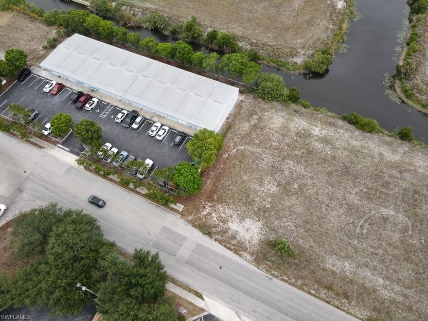 Cape Coral Corridor District Prime Commercial Lot in heavily trafficked and centrally located area-adjacent to the North Pointe Shoppes & Lowe's with proximity to Del Prado Boulevard N, Pine Island Road, & Diplomat Parkway. While enjoying a view of the freshwater canal, it is an "X" Flood Zone, meaning OUTSIDE of the FEMA Special Hazard Flood Area. Overall, this parcel offers an excellent opportunity for developers or investors looking to establish a presence in a vibrant commercial area, surrounded by a thriving community of businesses, restaurants, residential neighborhoods, and local amenities. Its strategic position & compact size offer the ability to efficiently invest and position a business in a thriving area. Don't miss this opportunity to benefit from the growing Cape Coral economy!