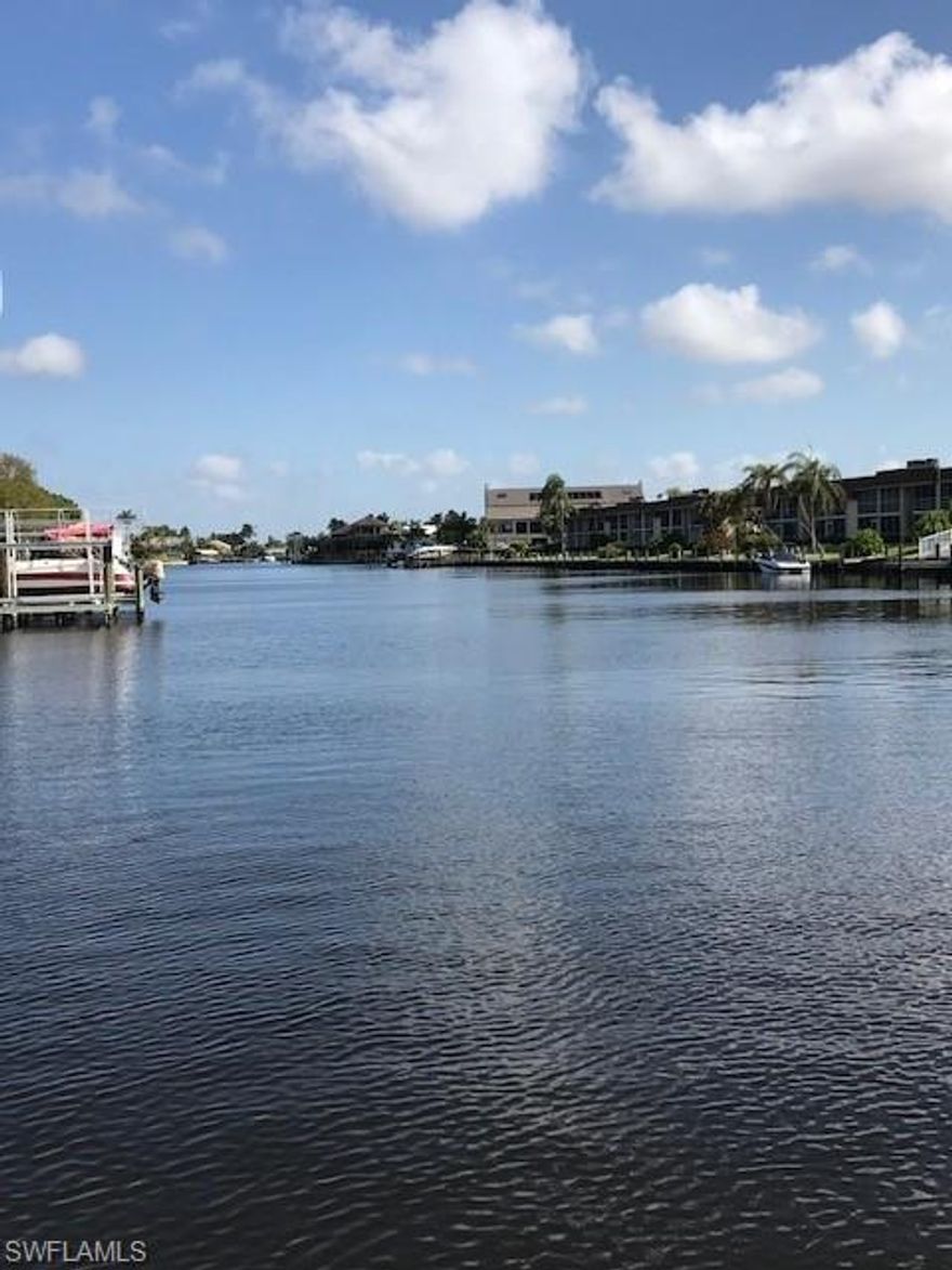 Are you STILL up North? YOU COULD BE HERE!  THIS ONE is GROUND FLOOR & IS OFFERED AS TURNKEY! CHECK THIS OUT...C'MON LETS TAKE A WALK...It's 10 Covered Steps from your car to the Front Door of Your FL Waterfront UTOPIA Home!  It's 5 more steps from your patio to the POOL! 20 more steps to Your Boat On YOUR Lift In YOUR DEEDED BOAT SLIP! AND LESS THAN 5 min out to The River Heading out to the Turquoise Blue Waters of the Gulf Of Mexico! That's No Lie! This Rare Unique Great Room with split bedroom Floor plan condo conveys with the Slip and the 10000 lb Lift that can accommodate any boat length! Did I mention---its on a 200' +canal? Have your Family Picnic & BBQ in a  2 min walk to Jaycee Park On the river! This home has been meticulously Loved by the owners; this entire HOA is LOVED by ALL its owners! Beautiful Granite Ctops in the Bright White Kitchen; Diagonal Tile in the Great Room! Hurricane Shutters for all Windows. Inside Laundry Room! Extra Storage! HUGE WALK IN Closet in Master Bedroom! Walk out your Sliders & Start EVERY DAY with Your Cuppa watching the Famous FL Sunrises and End EVERY DAY watching the Famous FL Sunsets Under the Palm Trees & Stars! STOP DREAMING! CALL ME!