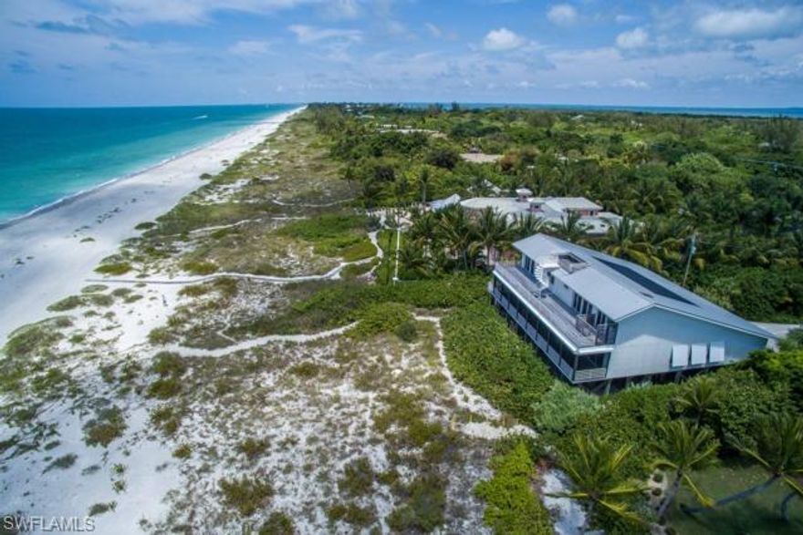 A Majestic Captiva Island Beachfront Estate. A private and beautifully landscaped driveway opens up to over one acre of a pristine and inviting setting. Situated due west this unique and special piece of paradise offers 5 bedrooms/5 baths w/2 separate guest suites and an awe inspiring raised swimming pool that flows within the surroundings of the home is nothing less than spectacular. The artistic flair designed residence offers both a beach and contemporary home blend. Private elevator, art studio, exterior decking on both living levels captures vistas that were inspired to showcase Captiva at its finest.