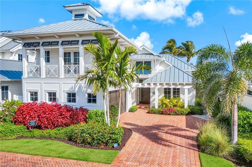 A Boater’s Dream and Priced $1,215,000 below prior sale! New interior decor. Discover unmatched luxury in this furnished 4 BR, 4.5 BA residence in the prestigious Mangrove Bay community. With direct boat and slip access to the Gordon River and Gulf, and just one mile from the vibrant shops and dining of 5th Avenue, this home offers the ultimate Naples lifestyle. Inside, you’ll find a designer kitchen with custom cabinetry, Wolf and Sub-Zero appliances, and elegant flooring throughout. Vaulted ceilings add to the light and airy feel, while the exceptional primary suite and private ensuite baths for each bedroom provide comfort and sophistication. The separate guest suite ensures privacy for visitors. Outdoor living is elevated with a summer kitchen, lanai, pool, and spa, perfect for entertaining or relaxing. Residents also enjoy access to a wellness and fitness center with a lounge and waterfront seating. Never affected by hurricane water intrusion, this home represents an extraordinary value in one of Naples’ most sought-after locations.