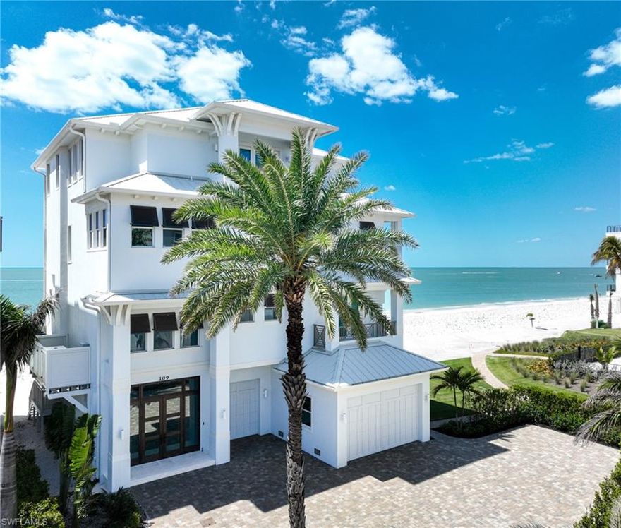 This 4 story Barefoot Beach Gulf front home sits on a valuable 1 2/3 lots right on the sand. The home was completely renovated, expanded & reimagined in a timeless light coastal style and was completed in 2019. The main living level great room is truly a great room with it’s massive size and the largest possible windows where the views make you feel like you are floating on the Gulf plus there are two fireplaces, a large walk behind bar and powder bath.  The spacious kitchen is open to the great room and the covered lanai with views of the turquoise waters & white sand every where you look and features custom cabinetry to the ceiling, top of the line appliances, a 10’ island with 3” quartzite counters and a hidden pantry.  The covered lanai has a large summer kitchen with grill, electric shutters, electric screens and leads to the open deck with views from Naples to Sanibel.  The office has Gulf views, a full bath and a queen sofa and doubles as the 7th bedroom when needed. The other 5 guest suites all have en-suite baths and Gulf views. There are a total of 7 full baths and 2 half baths all with designer selected finishes. The very private master bedroom, sitting room, covered lanai and bath are nearly 60” wide with large picture windows right over the water. The beautiful master bath will make you stop and take it all in and features an oversized shower, tub on the gulf with large window, wall of vanities and two water closets. The master closet is large enough for full time living.  The 4th floor recreation room provides the ultimate space for entertainment or as an oversized second living area. It’s wall to wall glass provides the perfect place to view those amazing sunsets.  A large bar with sliding window to the covered lanai also has electric screens and shutters. The wide lanai sits east to west with a sit at counter the complete distance overlooking the beautiful garden swimming pool, spa and large fire pit with Gulf views north and south.  A private elevator leads to all all 4 floors, volume ceilings, one touch lighting, quality millwork including ceiling details, and wide plank wood flooring throughout.  The garage will accommodate all your cars & toys and the oversized driveway will handle all your guests. The designer furnishings including art are available to purchase as well. Barefoot Beach, Collier County’s premier gated beach to bay community, amenities include 24 hour guards and patrols, Clubhouse with fitness, tennis, pickleball full time on site Manager, beach garden pool and more. Option to join the Club at Barefoot Beach (located in the community - waitlist with club usage) which offers casual & fine dining restaurants, pool & beachside food, drinks, chair service, indoor & outdoor bars, ice cream & coffee shop, tennis courts with pro & a full events calendar. Minutes to Mercato, Coconut Point Mall, Promenade & Waterside, the airports and golfing. Boat docks are available for lease or purchase right across the street.