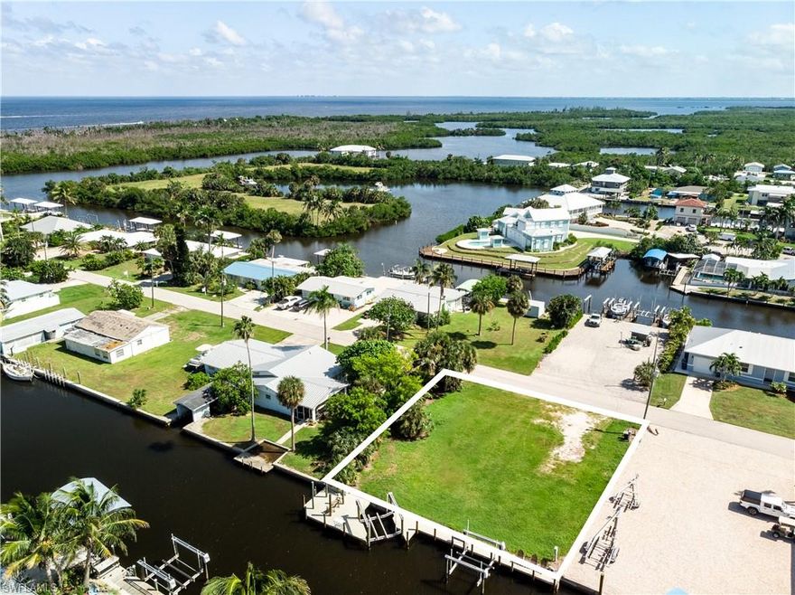 Discover an exceptional opportunity to own a piece of paradise on 16269 Buccaneer Street in beautiful Bokeelia, Florida.  This 100’ x 100’ waterfront lot offers the perfect foundation for your custom island retreat or boater’s getaway. Complete with a seawall and two 10,000 lb boat lifts, the property provides quick, direct access to open water and the Gulf of Mexico—ideal for fishing, cruising, and exploring the nearby barrier islands.

Enjoy peaceful canal views, gentle sea breezes, and a prime location on a quiet street just minutes from Jug Creek Marina and The Fish House, where Old Florida charm meets coastal adventure. Nestled at the northern tip of Pine Island, Jug Creek Marina serves as both a launching point for unforgettable days on the water and a gathering place for locals and visitors alike. With easy access to Pine Island Sound, Boca Grande Pass, and the Gulf, boaters will appreciate the marina’s full-service amenities, including dockage, fuel, bait, ice, and marine services.

Whether you’re ready to build now or invest for the future, this property offers unmatched waterfront living, combining convenience, value, and the relaxed island lifestyle that makes Bokeelia, Florida truly special.

Key Features:
100’ x 100’ waterfront lot
Two 10,000 lb boat lifts
Direct Gulf access via deepwater canal
Concrete seawall in place
Ideal for a custom home or  custom vacation retreat
Close to restaurants, marinas, and island attractions

Embrace the Southwest Florida lifestyle—boat, fish, and relax right from your backyard!