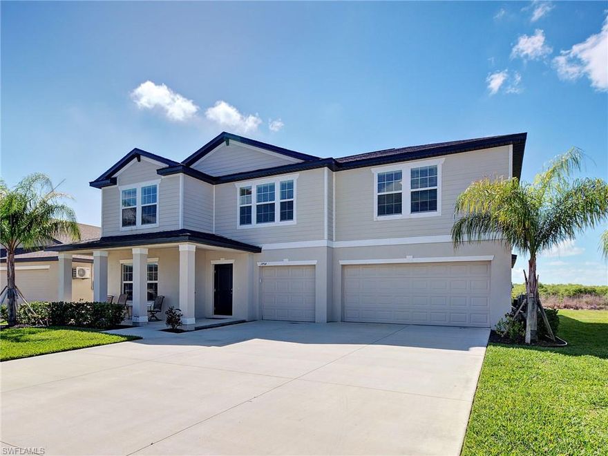Welcome to this stunning 5-bedroom, 3.5-bath pool home in the sought-after community of Crane Landing in North Fort Myers. Built just two years ago, this spacious 2 floor Cheyenne model delivers the perfect combination of modern design, flexible living space, and incredible indoor-outdoor Florida living.
The home welcomes you with a large covered front porch, the perfect spot to enjoy your morning coffee, relax in the evenings, or greet guests before they step inside.
Enter through the wide, inviting foyer, where you'll find a versatile room just off the entry that can easily serve as a home office, den, study, or flex space to fit your lifestyle. A conveniently located half bath sits nearby for guests.
The heart of the home is the beautiful open-concept kitchen, dining, and living area, designed for both entertaining and everyday comfort. The kitchen features granite countertops, stainless steel appliances, and a large walk-in pantry, all overlooking the expansive living space and the home’s show-stopping backyard oasis.
The first-floor primary suite offers a private retreat with a spacious bedroom and a beautifully sized ensuite bathroom featuring dual vanities, a large walk-in shower, linen storage, a private water closet, and an oversized walk-in wardrobe.
Upstairs you’ll find four additional bedrooms and two full bathrooms, offering plenty of room for family or guests. All four bedrooms are bright and inviting, with one featuring a walk-in closet while the others offer built-in closet space. Both upstairs bathrooms include tub and shower combinations with private toilet rooms.
The second floor also features a spacious loft that works beautifully as a second living room, media room, or family gathering space, giving everyone room to spread out and relax.
Step outside and you’ll quickly see why this home stands out. The backyard has been professionally landscaped and transformed into a private retreat with a brand-new heated saltwater pool featuring underwater lighting, a water fountain feature, and a screened cage enclosure. The pool reaches six feet deep and includes step-down entries with areas designed for lounging and soaking up the Florida sunshine.
The backyard overlooks a peaceful preserve, offering privacy and a beautiful natural backdrop. With plenty of room for gatherings, cookouts, and relaxing evenings, the outdoor space truly becomes an additional living area for this incredible home.
Additional features include a massive three-car garage with extra storage along the back wall, bonus storage under the stairs and a laundry room.
Residents of Crane Landing enjoy fantastic community amenities including a playground, basketball courts, tennis courts, and pickleball courts, creating a vibrant and active neighborhood.
Space, comfort, privacy, and a resort-style backyard, this home truly checks every box.