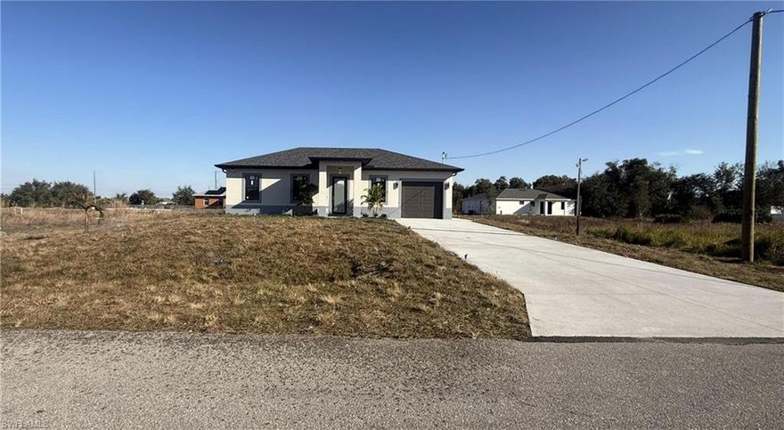 ¡¡NEW CONSTRUCTION!! SELLER CONTRIBUTION AVAILABLE

Welcome to this stunning new construction home located in the heart of Lehigh Acres. This thoughtfully designed residence offers 3 bedrooms, 2 bathrooms, a dedicated laundry room, and a 1-car garage, providing comfort and functionality for everyday living.
Conveniently situated near SR-82, schools, shopping, and just 10 minutes from Fort Myers, Southwest Florida International Airport, and I-75, this home combines convenience with modern style.

The open-concept floor plan features high ceilings and abundant natural light, creating a bright and inviting atmosphere. The kitchen is equipped with stainless steel appliances, quartz countertops, soft-close cabinetry, and under-cabinet lighting. The home also includes ceiling fans, a washer and dryer, and beautifully finished bathrooms with tiled walk-in showers.
Additional upgrades include exterior motion sensor lighting, a sprinkler system, and elegant soffit lighting installed around the entire home. The spacious backyard is perfect for family gatherings and outdoor entertaining.
Don’t miss the opportunity to own this beautiful, detail-oriented home—schedule your showing today!