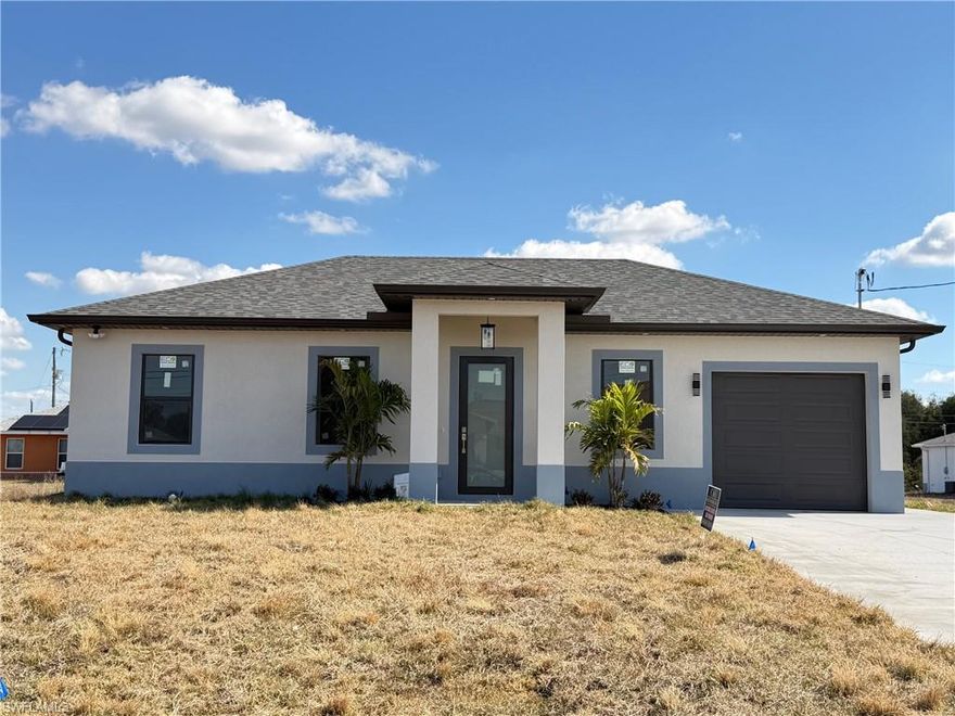 ¡¡NEW CONSTRUCTION!! SELLER CONTRIBUTION AVAILABLE

Welcome to this stunning new construction home located in the heart of Lehigh Acres. This thoughtfully designed residence offers 3 bedrooms, 2 bathrooms, a dedicated laundry room, and a 1-car garage, providing comfort and functionality for everyday living.
Conveniently situated near SR-82, schools, shopping, and just 10 minutes from Fort Myers, Southwest Florida International Airport, and I-75, this home combines convenience with modern style.

The open-concept floor plan features high ceilings and abundant natural light, creating a bright and inviting atmosphere. The kitchen is equipped with stainless steel appliances, quartz countertops, soft-close cabinetry, and under-cabinet lighting. The home also includes ceiling fans, a washer and dryer, and beautifully finished bathrooms with tiled walk-in showers.
Additional upgrades include exterior motion sensor lighting, a sprinkler system, and elegant soffit lighting installed around the entire home. The spacious backyard is perfect for family gatherings and outdoor entertaining.
Don’t miss the opportunity to own this beautiful, detail-oriented home—schedule your showing today!