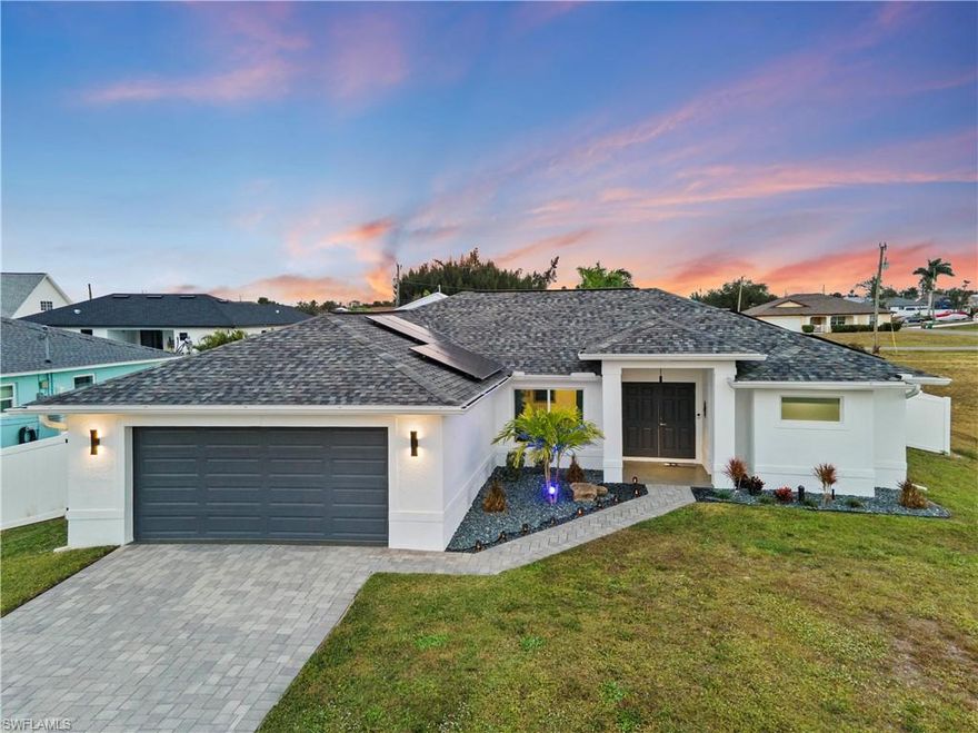 Wow! Do not miss this one! SO MANY  UPGRADES !Exceptional 4-bedroom, 2-bath (or could be a 3+den), 2-car garage home packed with premium upgrades—located in a highly desirable NO-FLOOD ZONE with HURRICANE IMPACT WINDOWS! This modern, move-in-ready property stands out with a flexible 4th bedroom that can serve as a home office, gym, or playroom, and sleek porcelain tile flooring throughout for a fresh, unified look. Tray ceilings in every bedroom add volume and style, creating an open and airy feel.

The upgraded kitchen is a true highlight, featuring quartz countertops, a walk-in pantry, and Samsung black stainless-steel appliances that deliver both function and flair. The spacious primary suite offers two walk-in closets and a supplemental A/C unit for personalized comfort year-round.

Designed for efficiency and peace of mind, the home includes a PAID-IN-FULL solar system, whole-home reverse osmosis, UV-wrapped ducts, surge protection, epoxy-coated garage flooring, updated lighting, ceiling fans, gutters, and a sleek glass-enclosed shower.

Step outside to your private backyard retreat with a 48x7 heated saltwater lap pool, full screen enclosure, and concrete pavers installed over 4” of concrete for long-lasting durability. A vinyl privacy fence and fresh landscaping complete this serene, resort-style setting.

With hurricane protection, extensive upgrades, energy efficiency, and a prime location, this home delivers the perfect blend of luxury, comfort, and lifestyle. Schedule your private showing today—this one truly stands out!