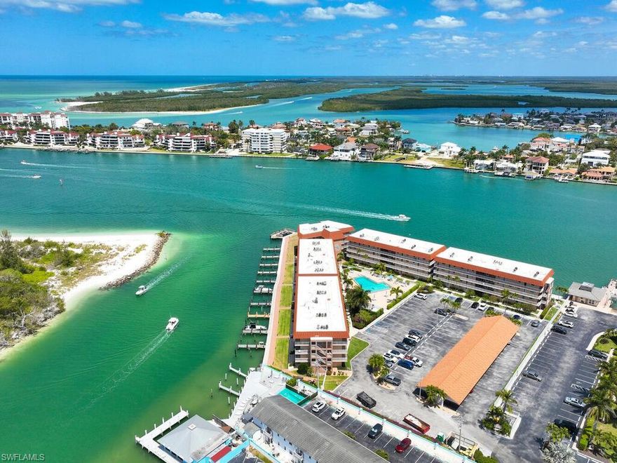 Exceptional, wide water views abound from this gorgeous 2 bedroom, 2 bath residence! This island gem offers a light and bright interior, well equipped kitchen with pool views and coastal accents, and absolutely stunning views of the Marco River. The wraparound, riverfront terrace is the ideal place to relax and unwind. Enjoy island life to its fullest – phenomenal views, fresh salt air, gentle island breezes, and dolphins frolicking right outside your doors. Ville de Marco West is nestled between the Marco River and Collier Creek, providing exceptional water views, and boasts a beautiful pool, social room, and fishing pier – the perfect place to take in the island’s world-famous sunsets. This prime location in charming Olde Marco boasts close proximity to several restaurants, entertainment, art galleries, shopping, and more. Don’t miss the opportunity to make this waterfront haven your personal piece of paradise.