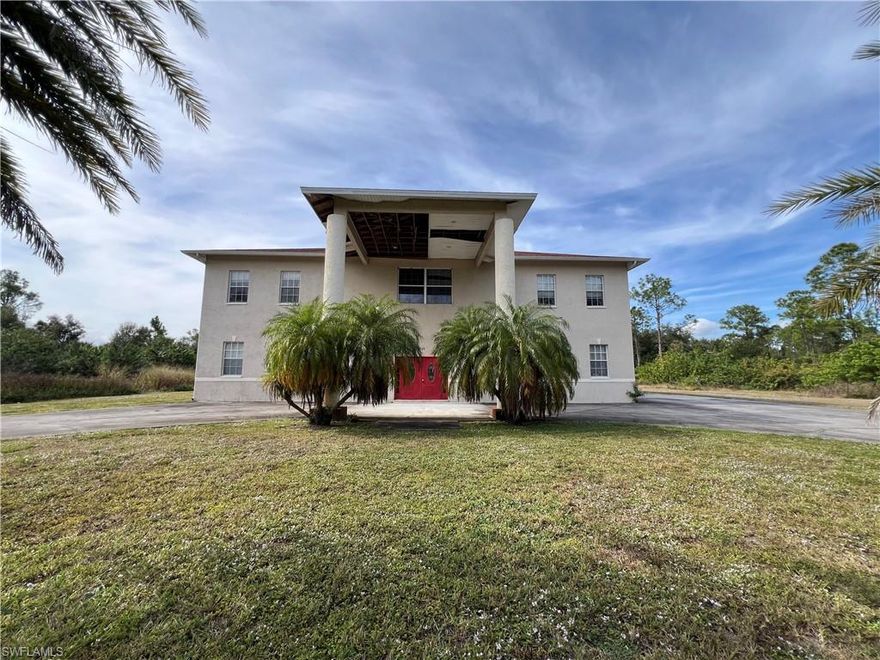 Two-story house built in 2007 offering 5 bedrooms, 3.5 baths, 3 bonus rooms and 5,452 square feet under air, situated on a full acre with west rear exposure and no flood zone. A double-door entry opens into a very large great room with a full two-story ceiling. The main level also includes a separate living room with recessed lighting, kitchen with island and double oven, oversized dining room, and three office or flex spaces, including a small insulated studio room. Ten-foot ceilings run throughout the first floor, with tile flooring and access to a small under-truss lanai.

All five bedrooms are located upstairs, including four guest bedrooms and an oversized primary suite with a 15x15 walk-in closet and a large bath with dual sinks, a separate soaking tub, and walk-in shower. Upstairs ceilings measure approximately 11 feet. Tile flooring continues throughout the home, with carpet in the primary bedroom only.

An oversized garage and newer roof add value. With its substantial square footage, ceiling heights, and acreage, this house offers an opportunity for a buyer to personalize a property of this scale.