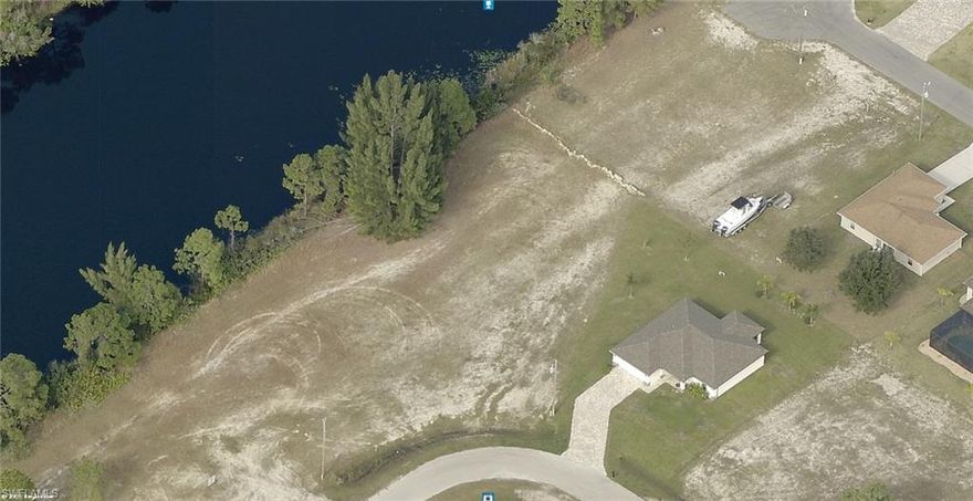 Waterfront lot on Gator Slough Canal. Over 200 feet wide freshwater canal!! Ready to close!! Great place to build your dream house! Large, almost .42 acre lot. The lot is a diamond shape with 105 feet of water frontage!! The sides are over 150 feet. 
 Plenty of room to build your new home. Located in NW Cape Coral. Great opportunity.