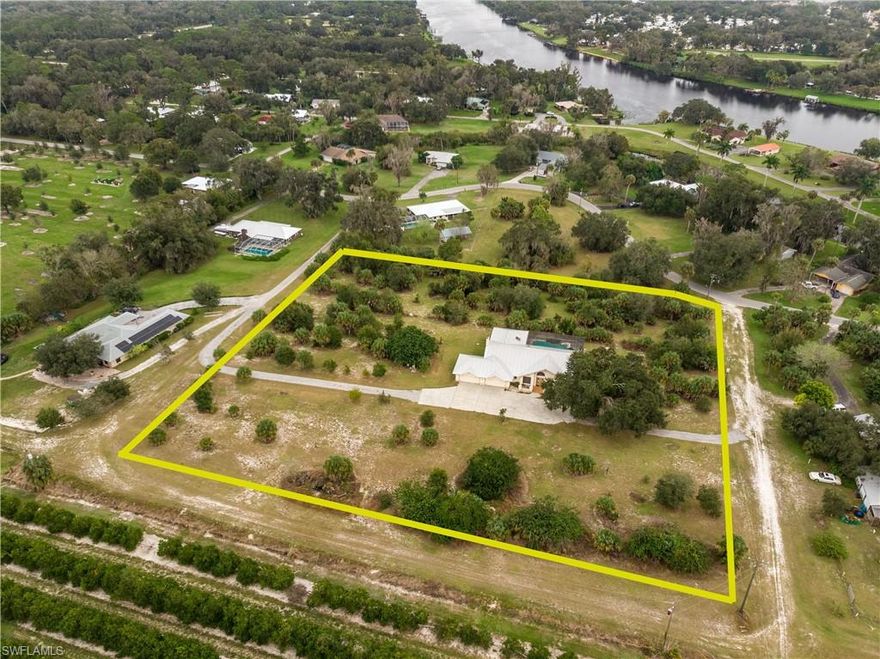 Price Reduced!!  Seller wants this one sold! This spacious Caloosa Estates Pool home boasts over 2900 sq. ft. in living space on almost 4 acres it is like owning a whole city block!  Best of all, the home has 4 bedrooms with 3 full bathrooms, four-car garage, metal roof 2011, new Bath Fitter shower 2020, a large open floor plan, electric and manual hurricane shutters and large caged pool/jacuzzi/lanai with outdoor grill area. Update this large family home and make it your own. 
This is one to see! Don’t delay call today for you private showing!