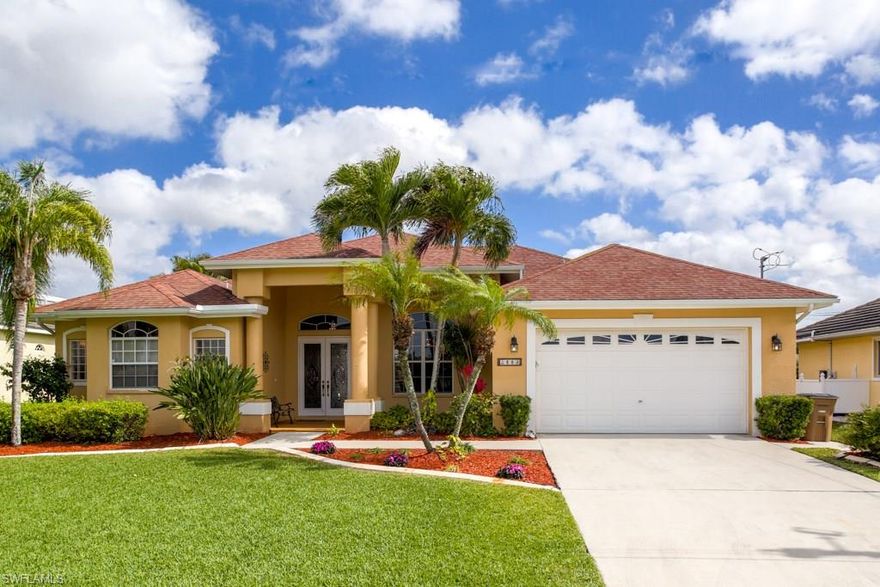 Located in the popular Four Mile Cove Area, this lovely Gulf Access Home awaits its new owner. Upon entering the home your eyes will immediately be drawn to the 550 ft long water views across wide intersecting canals, followed by a welcoming feeling of openness across the entire home. This home has both a Great Room Area and a Family Room Area, but rather than being blocked off from one another by walls separating the kitchen and family room, this plan is WIDE OPEN throughout all of the main living spaces. On top of that, the plan also features 90 Degree Disappearing Corner Sliding Glass Doors that bring the Indoor and Outdoor spaces together as one. The extensive use of Sliding Glass Doors and Oversized Windows provide plenty of natural sunlight and maximize the water views from almost every room inside the home. This is what Florida Living is all about! Outside you’ll find a Large Sparkling Swimming Pool with a Waterfall Feature, an Oversized Extended Pool Deck with plenty of room for Lounging or Entertaining, and a spacious Covered Lanai with a Built-In Summer Kitchen. As an added convenience, this home could also be available to be purchased Fully Furnished or even Turnkey.