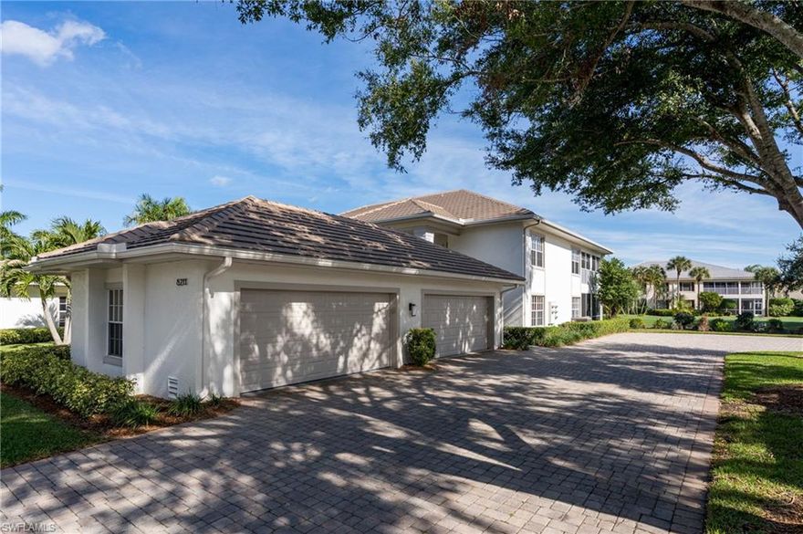Offered at an amazing price in the amenity-rich Estero Country Club at The Vines. This massive first-floor corner condo has 3 bedrooms, 2 full baths, and a detached 2 car garage. The open great room floor plan offers lots of natural light with lots of space between the master suite and the guest rooms. Enjoy the dazzling views of the golf course's 9th tee and desirable eastern sky from your spacious and unique L-shaped lanai which has electric storm shutters on all sides. The renovated kitchen has plenty of space with new cabinets and granite countertops. The expansive master suite has an en-suite bath complete with separate shower, relaxing soaking tub, linen closet, and a large walk-in closet along with a standard double closet. There is also a laundry room and tons of closet space throughout. Get the luxuries of country club living with the no-maintenance condo life! New roofs, exterior paint, fixtures, and gutters all recently re-done in Grand Palm. Only a short drive to shopping, restaurants, and the beach. Your piece of paradise in southwest Florida is calling you. Schedule a tour today. This condo won't last long at this price.