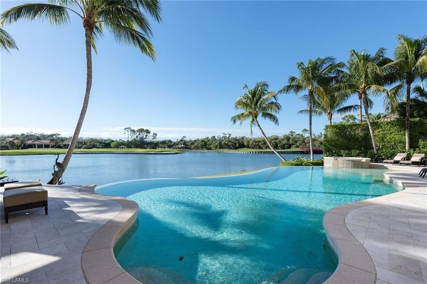 Picturesque & perfect sunsets. Wide water and golf course views. Elegant Harwick Homes custom home with over 8,200 square feet of luxury living. 5 en-suite bedrooms, 6 full & 2 half baths, media room, dual offices with custom cabinetry. Walk-in climate-controlled wine room. Sublime master suite includes dual bathrooms and multiple custom closets. The grand entry and open plan stream natural light through the impeccably maintained home and views beyond. Gourmet kitchen, 2 dishwashers, Sub-Zero, Wolf appliances, extra fridge drawers. 2 laundry rooms. Elevator. Comprehensive storm protection. Motorized retractable insect screens. Gas heated pool and spa. Garage with reinforced doors and A/C houses 4 cars plus lift. Newer HVAC systems and so much more. An outdoor living space to enjoy the Naples lifestyle to the fullest while enjoying Grey Oaks Country Club offers 54 holes of championship golf, tennis, wellness, dining, fun while being a short drive to Old Naples and beaches.