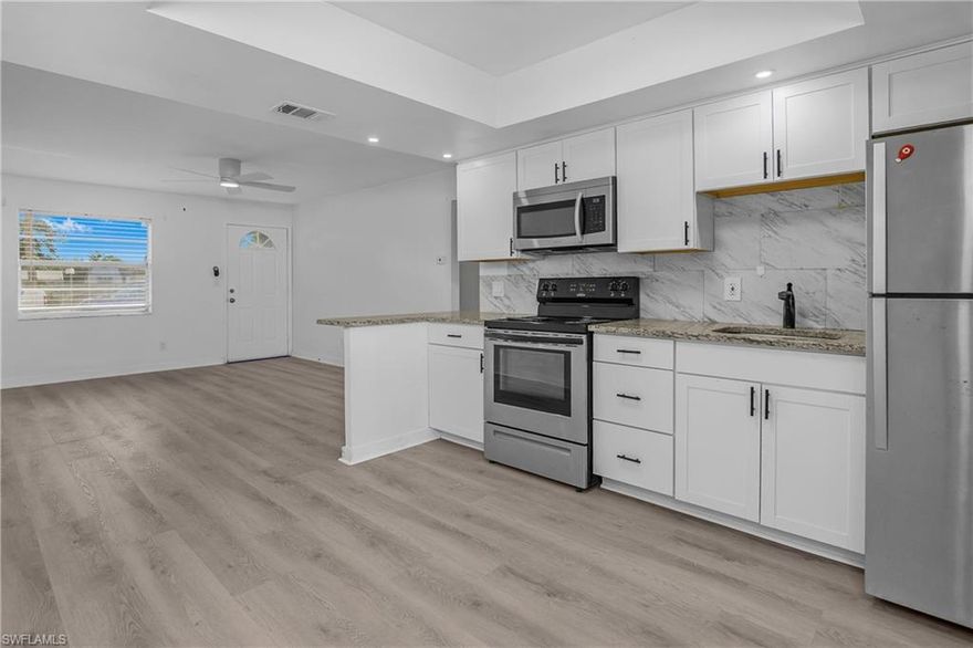 2/2 bottom floor condo in the heart of Bonita Springs. Condo has brand new LVP flooring and updated bathrooms and kitchen. There is a den/bonus room and large screened in lanai. Walk to downtown Bonita where there is the Sugar Shack, coffee shop, ice cream shop, park, restaurants, etc. Enjoy concerts, art shows, festivals and more right at the park. Condo complex has a pool and canoe/kayak launch to use your kayak or canoe right on the Imperial River. About a 15 min drive to Bonita Beach. Priced for quick sale.