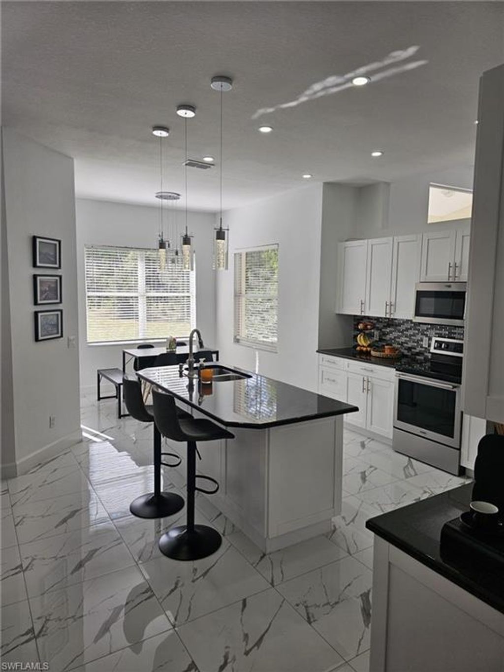 Photo of 4340 Golden Gate BLVD E, NAPLES, FL 34120 (MLS # 226005179)