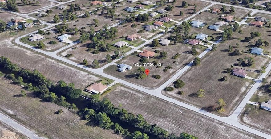 Discover the perfect canvas for your dream home on this oversized corner lot, not in a flood zone! Ideally situated down the road from a future of exciting possibilities. The future Festival Park, just a stone's throw away, promises to become a hub of entertainment and community gatherings with an amphitheater & an array of activities. For those who savor the delights of dining and shopping this area has so much to offer: the future Cape Coral Town Center, featuring a mix of retail & restaurant options, the exciting 7 Islands project, where waterfront dining, shopping, & entertainment are set to flourish, & the charm of Matlacha, the quaint artsy fisherman village where you can savor the freshest seafood right off the commercial fishing boats. Nature enthusiasts & adventure seekers will be delighted by the nearby options: the future Crystal Lake Park will offer a picturesque beach, food truck park, kayaking, scuba diving, & more, Yellow Fever Creek Preserve will offer equestrian & hiking trails, camping spots, fishing opportunities, & a dog park. To top it all off, this area is seamlessly connected with convenient access roads, making it effortless to explore the town.