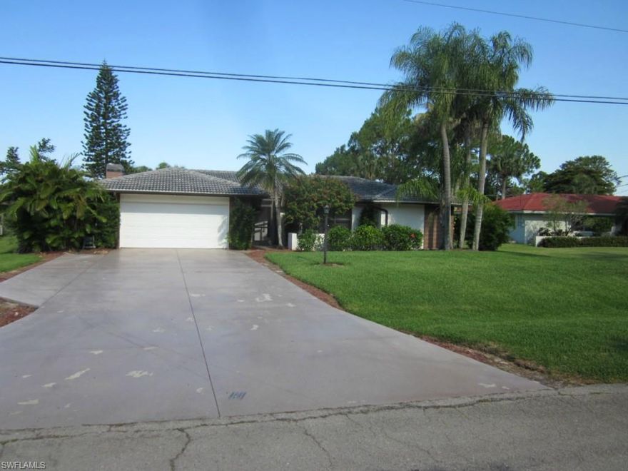 This 4 bedroom, 3 bath pool home on a 1/2 acre lot is priced to sell.  Enjoy the partial view of the fairways of Cypress Lake Country Club (NO MEMBERSHIP REQUIRED) and the sunsets from the private screened pool deck complete with pre-wired surround sound.  For those cool nights, warm up by the built in fireplace in the family room.  This home features 18" tile throughout except for the carpeted guest bedrooms.   This home also features California closets in the master and rear guest bedroom.  Rear guest bedroom also comes equipped with two twin Murphy beds.  Raise the Murphy beds up, and you have instant office space if you desire.  Automatic storm shutters stretch along the rear of the home.  The home is equipped with a central vacuum system, but the owner does not know if it is operable.  Septic tank replaced in 2010.  4 ton a/c system installed in 2013.