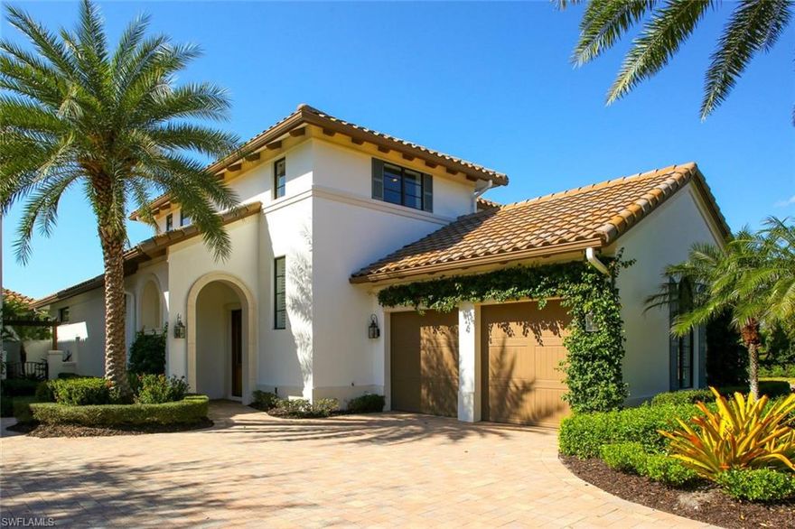 This magnificent waterfront residence is located in the prestigious Watercourse community in Talis Park. Exceptional quality throughout this custom built 2-story home with 4 beds, 4 baths, 2 car plus golf cart garage, pool & spa surrounded by lush greenery. Open floor plan features volume ceilings, recessed ceiling speakers in great room, 24x24 tile in a timeless brick pattern, remote control window shades in dining room & great room, custom designed stair railing, upgraded epoxy garage floor. Kitchen offers quality cabinetry, luxury Viking appliances, Pompeii Quartz counters, a large preparation island with casual eat-in, decorative tile backsplash, & large walk-in pantry. Master suite features tray ceiling, Karastan carpet, his & her walk-in closets with custom organizational system. Master bath features his & her vanities, walk-in shower, step-up tub. Outdoor living area offers covered lanai ceiling with recessed lights and cypress beams, outdoor kitchen with natural gas BBQ, refrigerator, & luxury fire pit. Ideally located steps from the driving range, bocce, tennis court, short walk across the bridge to the workout facility, fitness studio, & the award-winning Vyne House club.