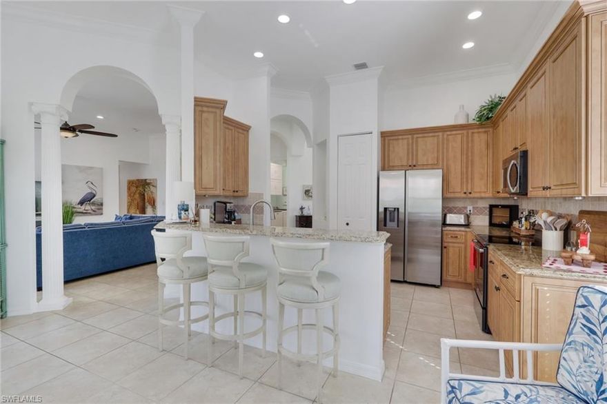 Magazine showcase ready this stunning rare Las Palmas floor plan offers 3 bedrooms plus a den, a formal sitting area as well as a large dining area right off the kitchen. A great home to entertain in. Roof 2018, Accordion shutters on windows and patio area for extra protection. Enter the double doors and be wowed by the high ceilings and natural light flowing through the home. Tile throughout main living areas, den and bathrooms, bedrooms have durable carpet for your comfort. Remodeled kitchen with stainless steel Bosch dishwasher, GE Range and Refrigerator, Samsung new 2026 Microwave, granite counters and tile backsplash. Crown molding throughout the home and new paint. Laundry room with Maytag washer and dryer. Main Bedroom offers two large walk-in closets, Tray ceiling and an ensuite bath with separate tub and walk in shower, double vanity. Guest bath features single vanity and shower tub combo. Enjoy the Florida lifestyle on your oversized screened in patio with pool and lake view. Cascades at Estero is a gated active 55+ community with a 26K SF clubhouse oversized indoor/outdoor pools, ballroom, card, arts & crafts rooms, billiards, fitness, sauna, 4 pickle ball, bocce, 5 HAR-Tru tennis courts, low HOA fees. Convenient location with shops, restaurants, medical and close to airport. Pet friendly. HOA fees even include cable and Internet and home security, landscaping and recreational facilities saving residents hundreds of dollars a month!!!!!