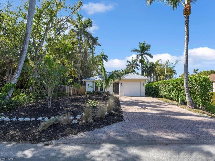 CHARMING NAPLES CLASSIC NEIGHBORHOOD! Situated in one of the most sought out areas in Naples- only one mile from the beach, short drive to the world famous shopping & dining off of 5th Ave S district, plus this location has easy access to Tamiami Trail where there a tons of shopping/dining/entertainment options. This updated home offers a very private setting w/ being set back from the road and having a fenced-in backyard. Inside you will find a comfortable floor plan w/ great room design, fully renovated kitchen w/ cottage chic design, high-end appliances, glass subway tile backsplash, designer grade light fixtures & fans, premium top-of-the line cabinetry & hardware, contemporary designed renovated baths, custom closet systems, and an updated laundry room w/ cabinetry & quartz topped folding/storage area. There is an attached deep 1-car garage, plus in the rear of the home there e is an open lanai w/ pavers overlooking a huge backyard. The non-gated neighborhood is known for its Olde Naples flair w/ tropical lush landscaping and custom built single family homes. Fantastic home for both seasonal and annual SWFL living!