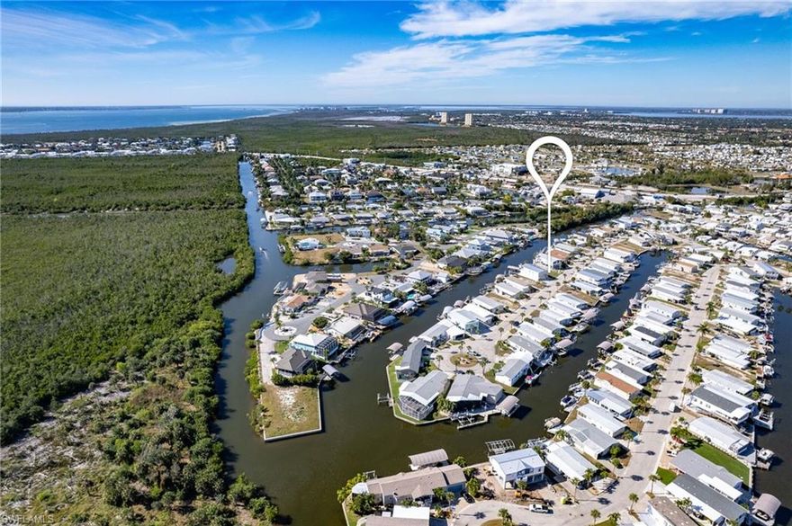 Experience True Waterfront Living in Bayside Estates!

Here’s your chance to own a premium Gulf-access lot in the highly desirable 55+ boating community of Bayside Estates, where lifestyle, convenience, and location all come together. This oversized homesite is ideal for building your dream home or adding to your investment portfolio, all while enjoying quick access to Fort Myers Beach, waterfront dining, and coastal attractions.

Enjoy the ultimate Florida boating lifestyle with direct Gulf access right from your backyard. The property is equipped with a boat dock and a larger boat lift, and the electric has been updated and is up to code, giving you peace of mind and immediate functionality.

Bayside Estates is known for its welcoming atmosphere, low HOA fees, and incredible value, just $700 per quarter, which includes water, sewer, trash, lawn care, and fiber-optic internet. Simply provide electric and you’re set!

This vibrant community offers something for everyone, featuring a large resort-style pool, tennis courts, pickleball, bocce, shuffleboard, clubhouse activities, weekly social events, dances, dinners, clubs, and even a yacht club for boating enthusiasts. Whether you love staying active or connecting with neighbors, there is always something to enjoy.

Plus, you’re only 2.5 miles from Fort Myers Beach and Jimmy Buffett’s Margaritaville, making it perfect for beach lovers and bike-ride enthusiasts who want to soak in the Southwest Florida lifestyle.

Opportunities like this are rare, secure your slice of paradise and start enjoying waterfront living the way it was meant to be!
