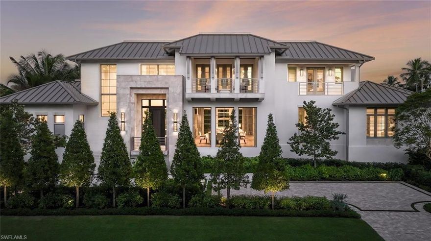 This custom estate, located on a sought-after corner homesite within walking distance of the beach and Third Street South, has been meticulously constructed by London Bay in collaboration with Stofft Cooney Architecture, Exteriors by Koby Kirwin, and Romanza Interior Design. The estate features an open-concept design that seamlessly integrates both indoor and outdoor spaces. The great room, dining room, and kitchen transition effortlessly into a covered outdoor area, which includes an alfresco living room with a fireplace, a dining space, and an outdoor kitchen, all set within a tropical oasis characterized by lush, mature landscaping. The elegant kitchen is equipped with a large island that accommodates seating for five, alongside a well-appointed butler’s pantry discreetly concealed behind cabinetry. The primary suite is designed with a custom dual walk-in closet and two opulent full bathrooms, one of which includes a soaking tub and a vanity. The study, located across from the foyer, features an interior glass wall and windows that allow an abundance of natural light, framing picturesque views of the thoughtfully designed water features, pool, and spa. On the second floor, three generously sized en-suite bedrooms provide private access to covered balconies. Additionally, guests will find convenience in the laundry room and a loft area that includes sliding doors leading to a balcony. The tropical contemporary architecture is characterized by stone accents, a metal roof, and a motor court for guest parking, and is further complemented by the vicinity of newly constructed homes. Additional noteworthy features include an elevator, generator, natural gas and a three car-garage.