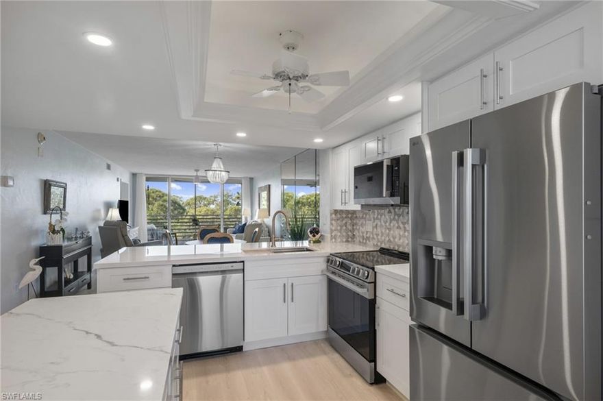 This beautifully updated 2 bedroom, 2 bathroom Bay Forest condo offers comfort, style, and a relaxed coastal setting. Situated on the 6th floor, the residence features new LVP flooring and a bright, open layout that captures peaceful views.

The updated kitchen is a standout with an island, stainless steel appliances, and a charming breakfast nook, plus additional space for dining just beyond the kitchen. It opens into a spacious living area that leads to a screened lanai, creating a wonderful spot to unwind while enjoying a ribbon view of the Gulf and surrounding natural scenery.

The generous primary bedroom serves as a private retreat with a walk-in closet and an updated ensuite bathroom featuring dual sinks and a walk-in shower. A comfortable secondary bedroom and a stylish full bathroom offer flexibility for guests or a home office. A dedicated laundry room with laundry tub and a private storage unit on the same floor add everyday convenience.

The building includes an elevator, making access to the sixth-floor residence easy, while Bay Forest is known for its exceptional amenities. These include a clubhouse with an active schedule of social events, pickleball and tennis courts, a fitness center, and bocce ball. Residents can enjoy walking paths that wind through serene lakes and preserved natural areas, along with a recently improved boardwalk that meanders through mangroves and coastal backwaters to a Chickee Hut and pier. A kayak launch provides easy access to the water for quiet paddles through the preserve.

An outstanding opportunity to enjoy easy, low maintenance coastal living in one of the area’s most desirable communities!