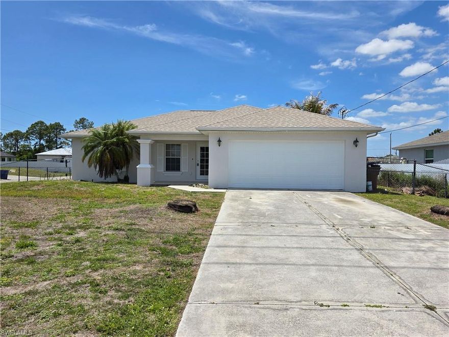 Welcome to this 3-bedroom, 2-bath single-family home in Lehigh Acres, ideally located just off Sunshine Blvd for a quick commute to State Rd 82, Lee Blvd, Fort Myers, and Southwest Florida shopping, dining, and commuter routes. Positioned on a large corner lot, this property offers extra yard space, privacy, and standout curb appeal with a freshly painted exterior. Inside, the open-concept floor plan creates an easy flow between the living, dining, and kitchen spaces, featuring granite countertops, tile flooring throughout, and abundant natural light. The layout is ideal for everyday living, entertaining, or buyers searching for move-in ready homes for sale in Lehigh Acres. Step outside to the large screened lanai with western exposure, perfect for enjoying Florida sunsets and year-round outdoor living. The fully fenced backyard offers plenty of room for pets, play, or adding a future pool, making this home especially attractive for buyers wanting outdoor flexibility. Additional buyer-friendly advantages include Flood Zone X location for potential insurance savings, low-maintenance tile floors, and a spacious lot that enhances long-term value. A strong option for buyers seeking a corner lot home in Lehigh Acres with fenced yard, lanai, and pool space near Sunshine Blvd.