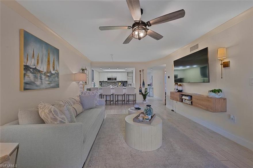 Discover effortless coastal living in this beautifully updated 3-bedroom, 2-bathroom ground-floor turnkey rental located in Naples Keep, offering the perfect blend of comfort, style, and convenience. From the moment you step inside, you’ll appreciate the thoughtfully designed interior featuring plank tile flooring, sleek stainless steel appliances, updated countertops, and fresh tilework that enhance the home’s clean and contemporary feel. The décor is finished in tasteful neutral fabrics and a soothing color palette, creating a warm and inviting atmosphere throughout. The bright and open main living area is anchored by large glass sliders that lead to the private lanai, allowing natural light to flow freely and creating an ideal setting for morning coffee, quiet reading, or evening entertaining. The primary bedroom retreat also features its own slider to the lanai, offering a peaceful connection to the outdoors along with a spacious walk-in closet and beautifully updated finishes that elevate the space. The second bedroom includes a comfortable queen bed and a spacious closet, making it perfect for guests or extended stays. The third bedroom, furnished with two twin beds, provides excellent flexibility—ideal for families, visitors, or those in need of a dedicated office or hobby room. A charming front porch welcomes you home and adds another cozy space to enjoy the surroundings. This property is being offered fully turnkey, making it completely move-in ready. Ideally situated in Naples Keep, this home places you just minutes from world-class beaches, boutique shopping, dining, and everyday conveniences. Enjoy the best of the Naples lifestyle with easy access to everything you need. Residents also have access to a sparkling community pool, providing a relaxed, resort-style environment right at home. With its updated features, ground-floor convenience, and prime location, this turnkey rental is an exceptional opportunity to experience effortless Southwest Florida living.