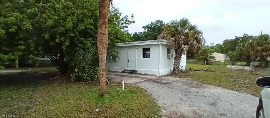 Looking for a forever home, retirement, or vacation home? Come check out Glades County's little town of Moore Haven where the folks around here are friendly, and southern hospitality are sure to make you feel welcome. Located on two city lots, this 2-lot parcel with a 2/2 mobile home has additional rooms built on, and it's also partly fenced.  Circular drive and nice large open area back yard to store your boat, and any other toys you have.  Concrete pad that can be used to park an rv with prior utility hook up.  (Will need to be verified for current use.) These lots are close to the Caloosahatchee River, boat ramps, schools, sheriffs dept, shopping, city hall, city water park, park area, county government offices.