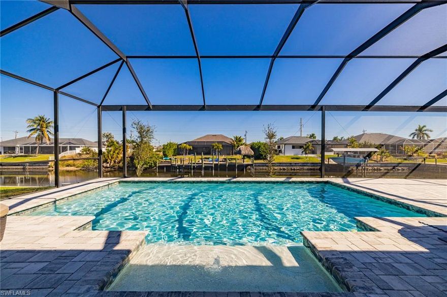 Welcome home to this stunning newly constructed gulf access pool home, designed for effortless Florida living. 

Inside, you’ll find an open, light-filled layout with soaring 12-foot ceilings and expansive windows that create a seamless flow throughout the home. Porcelain tile flooring, complementing the clean, modern design. The kitchen is both stylish and functional, featuring quartz countertops with a waterfall island, state-of-the-art appliances, and custom cabinetry.

The home offers three spacious bedrooms and three full bathrooms, each thoughtfully designed with high-end finishes. The primary suite is a true retreat with sliding doors leading directly to the lanai. The spa-inspired primary bathroom includes dual vanities, two walk-in closets, a contemporary freestanding soaking tub, and a large walk-in shower. One guest bathroom leads out to the pool, while the third bedroom features its own private ensuite.

Your private backyard oasis, complete with a sparkling pool, an oversized extended lanai, and a fully equipped outdoor kitchen—perfect for entertaining or relaxing at the end of the day. Impact-resistant windows and doors to add to the home’s quality and durability. 

Located in a desirable waterfront community with easy access to shopping, dining, and local amenities, this home truly offers the best of luxury coastal living. This is one you don’t want to miss.