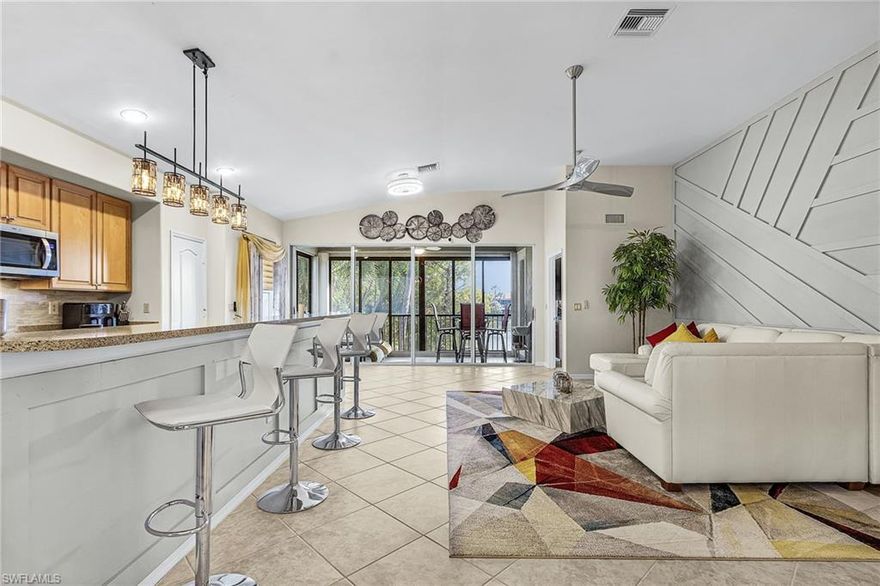 Superb Coach Home in Moody River Estates. Get ready for an elevated lifestyle in one of the area’s most sought-after communities, where resort-style living meets everyday comfort. This spacious two-story coach home offers over 2,000 square feet of thoughtfully designed living space, featuring 2 bedrooms, a versatile Bonus room, a private den, and a 2-car garage.

Superior upgrades include a NEW Roof, accordion and roll-down shutters, and beautifully designed accent walls in the living room, dining room, and primary suite, adding warmth and sophistication throughout. The open-concept great room layout is ideal for entertaining, seamlessly connecting to a well-appointed kitchen complete with stainless steel appliances, a pantry, breakfast nook, island seating, and a formal dining area.

What truly sets this home apart is its rare, private setting. With no neighboring views, you’ll enjoy peaceful, unobstructed lake views from both the front and side of the home. The enclosed lanai has been enhanced with sliding windows, creating additional living space and year-round enjoyment—open them up during cooler months to take in the fresh air and serene surroundings.

Residents of Moody River Estates enjoy an exceptional lifestyle with amenities including two heated pools, a spa, fitness center, clubhouse, business center, library, tennis and basketball courts, bocce ball, walking trails, a fishing pier, and a boat ramp.

Conveniently located just minutes from Downtown Fort Myers, you’ll have easy access to dining, entertainment, and shopping, while still being only 20 minutes to I-75 and 25 minutes to Southwest Florida International Airport.

This is Florida living at its finest—schedule your private showing today.