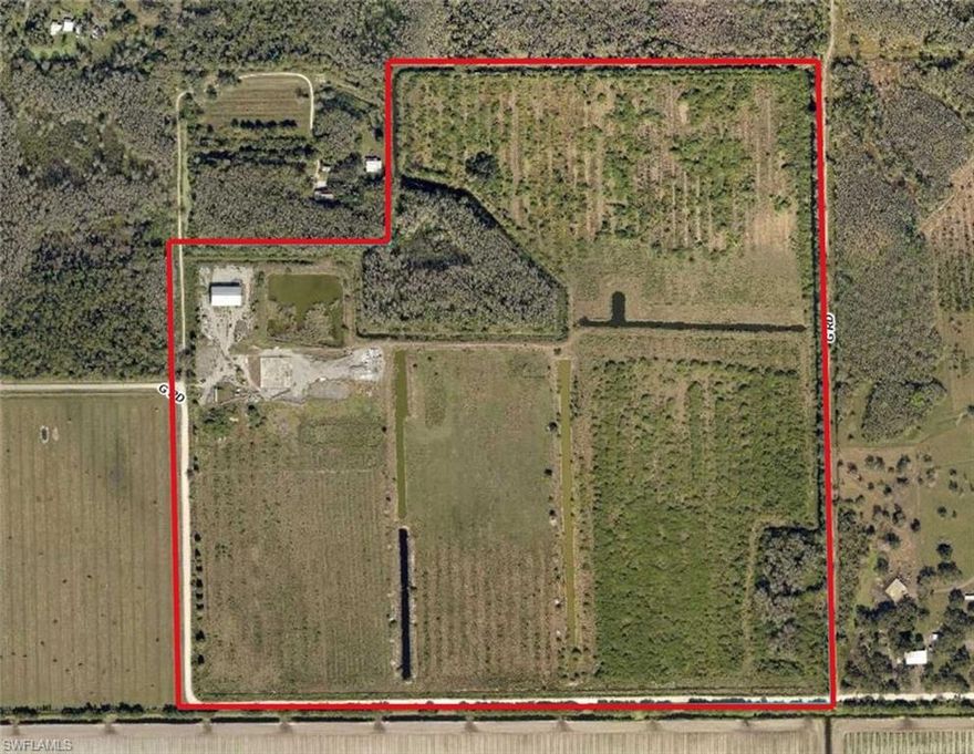 Positioned in a rapidly growing corridor just south of LaBelle and conveniently located between LaBelle and Immokalee, this expansive 144.5-acre property at 960 G Road presents a prime opportunity for agricultural investment or rural enterprise. Surrounded by warm climate conditions ideal for year-round productivity, the land is well-suited for a wide variety of uses including row crops, livestock, or other agricultural ventures.
 
The property features a substantial 55' x 125' steel warehouse, offering excellent space for equipment storage, operations, or future improvements. Existing infrastructure includes well, septic, and electrical service already in place, providing a strong foundation for development or continued agricultural use. The acreage is fenced, though portions will require repair, and includes canal systems that may assist with drainage or irrigation. 

With road frontage on two sides, access and flexibility for future use or division are key advantages of this tract.
 
Please note: The property is being sold As Is. It has experienced vandalism, and the current absentee owner has not been able to oversee cleanup or restoration. This is reflected in the price.

Whether you're expanding an agricultural operation, seeking a land investment, or looking for a large private holding in a growth area, this property offers significant upside at an attractive scale.