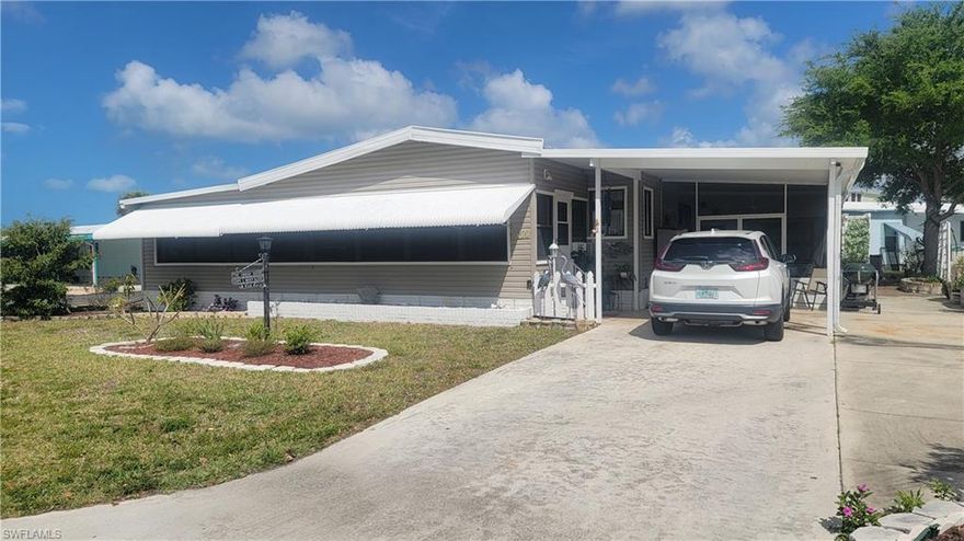 Corner property features multi generational floor plan or in-law wing with private entrance, private covered side parking, great room & bedroom & remolded bathroom, this area has lots of windows and plenty of light, split plan from the rest of the home. Updated kitchen with plenty of cupboards, drawers, and storage space & breakfast bar, Formal dining area for guests, large living room with natural light, exceptional office area with private entrance. Master bedroom opens to the vanity area with walk in closet and separate shower & commode. Large guest bedroom has closet with barn door. Outside there is storage, storage, storage, laundry room with utility sink, shelves, wall space, rear entrance and  separate man-cave workshop. There is a side screened lanai for enjoying the Florida lifestyle! The community features owned land, low HOA fees, community Gulf access boat ramp for the residents from which a boater can be in Estero Bay in 7 minutes and into the Gulf of America via New Pass in 13 minutes. Enjoy fishing, shelling, sandbar anchoring, beaches, waterfront restaurants, tropical sunsets and still boat home in minutes! The amenity rich community has a clubhouse, planned activities, pool, hot tub, tennis, pickleball, boccie ball, basketball, shuffleboard, billiards, library, fresh water lake at the community park with fishing pier, boat storage compound and free kayaks for the residence. Spring Creek Village is conveniently located minutes to the Coconut Point Mall, Lee Health at Coconut Point, Fort Myers International Airport, Hertz Sports Arena, public golf courses, restaurants, shopping, mid-way between Naples & Fort Myers yet off the busy road of 41 down the Coconut Corridor which leads to the Hyatt at Coconut Point which features restaurants shopping and full service messages and health spa. Great Property! Great Community! Great Location!!!!!